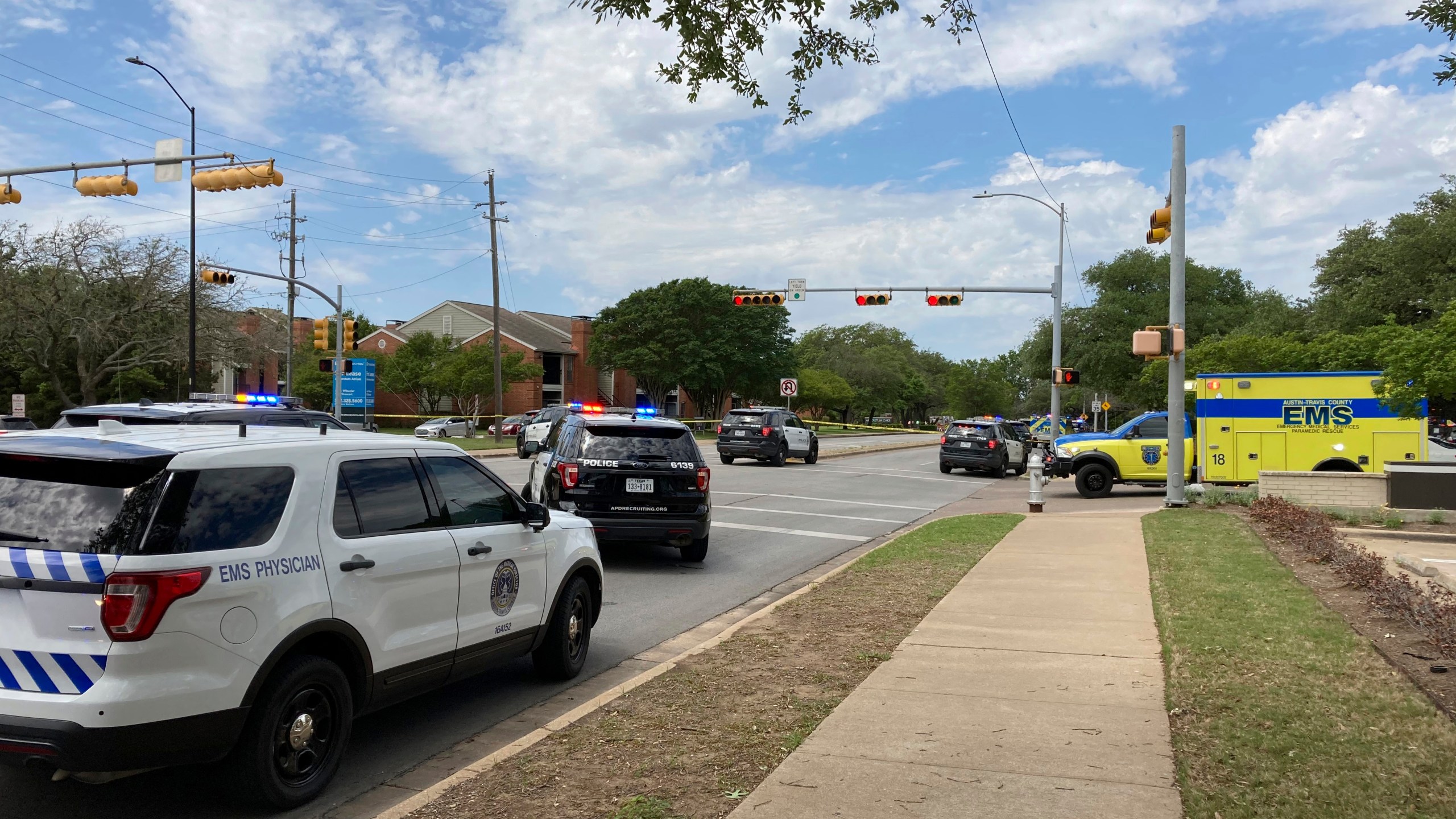 Police and emergency personnel work at the scene of a fatal shooting, Sunday, April 18, 2021, in Austin, Texas. Emergency responders say several people have been fatally shot in Austin and that no suspect is in custody. EMS spokeswoman Capt. Christa Stedman said early Sunday afternoon that it was still an active scene. (AP Photo/Jim Vertuno)