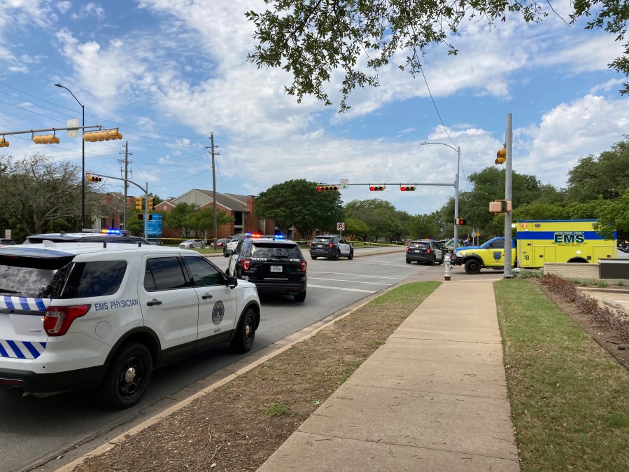 Police and emergency personnel work at the scene of a fatal shooting, Sunday, April 18, 2021, in Austin, Texas. Emergency responders say several people have been fatally shot in Austin and that no suspect is in custody. EMS spokeswoman Capt. Christa Stedman said early Sunday afternoon that it was still an active scene. (AP Photo/Jim Vertuno)