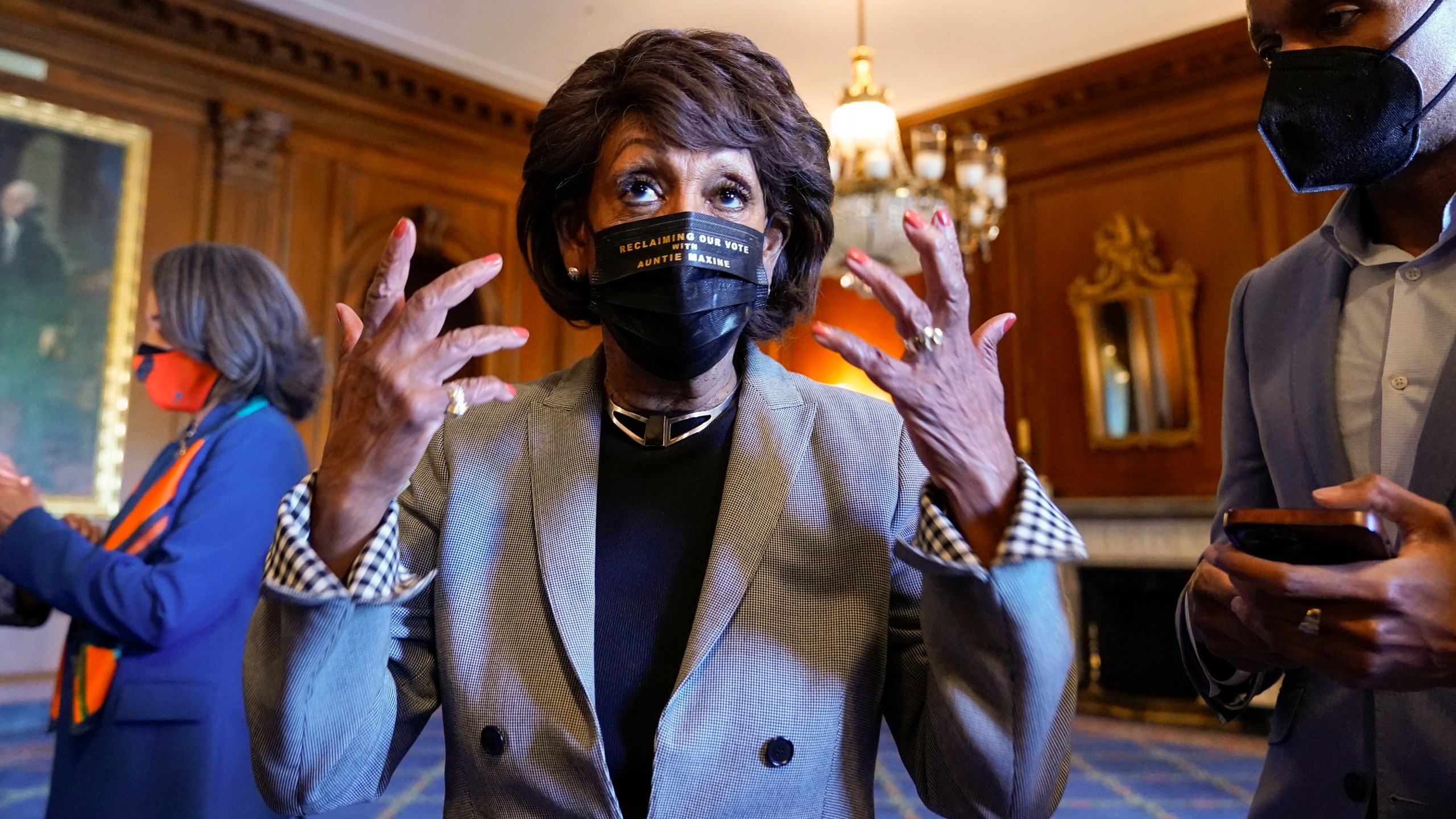 Rep. Maxine Waters, D-Calif., talks on Capitol Hill in Washington on Tuesday, April 20, 2021, as she waits for the verdict to be read in the murder trial of former Minneapolis police Officer Derek Chauvin in the death of George Floyd. (AP Photo/J. Scott Applewhite)