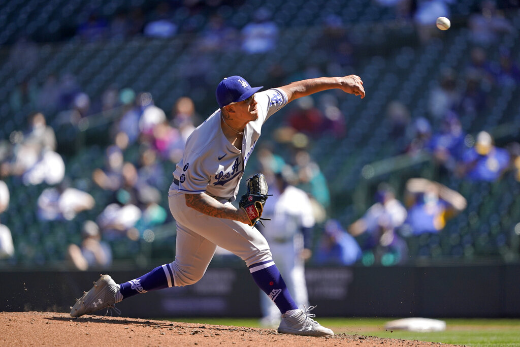 Los Angeles Dodgers starting pitcher Julio Urias throws against the Seattle Mariners in the fourth inning of a baseball game Tuesday, April 20, 2021, in Seattle. (AP Photo/Ted S. Warren)