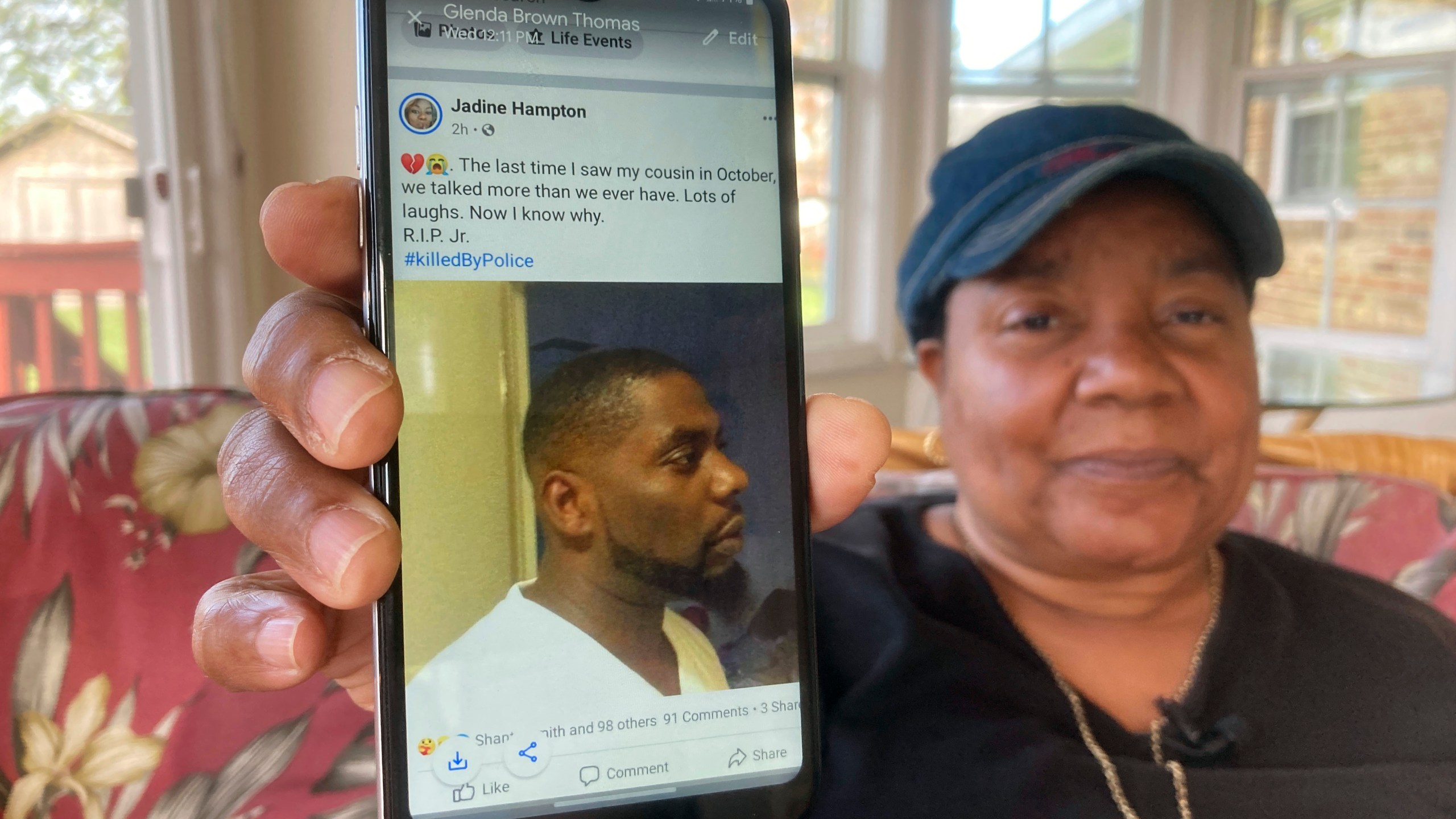 Glenda Brown Thomas displays a photo of her nephew, Andrew Brown Jr., on her cell phone at her home in Elizabeth City, N.C., on April 22, 2021. Brown was shot and killed by a sheriff's deputy who was attempting to execute a warrant. (Allen G. Breed / Associated Press)