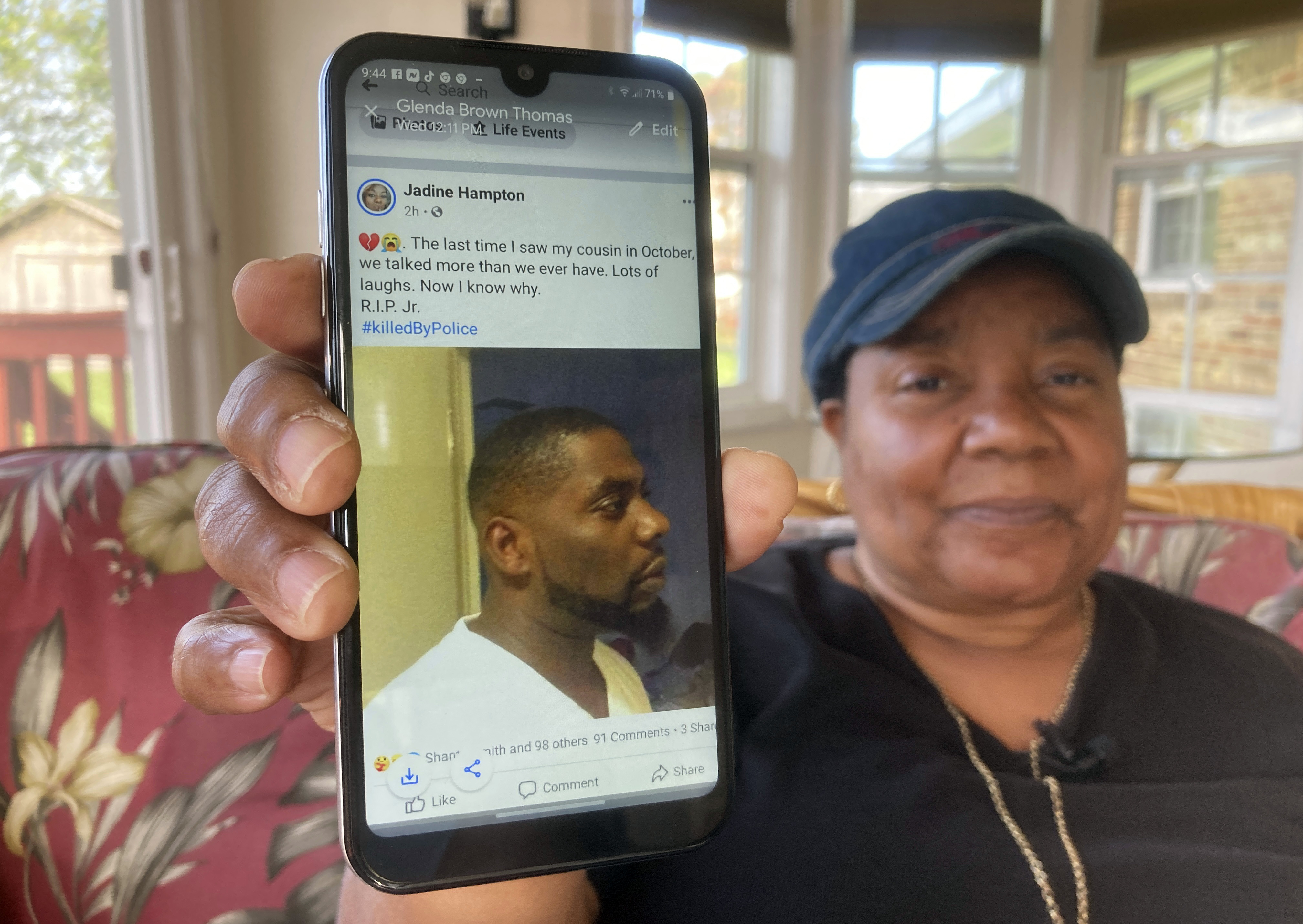 Glenda Brown Thomas displays a photo of her nephew, Andrew Brown Jr., on her cell phone at her home in Elizabeth City, N.C., on April 22, 2021. Brown was shot and killed by a sheriff's deputy who was attempting to execute a warrant. (Allen G. Breed / Associated Press)