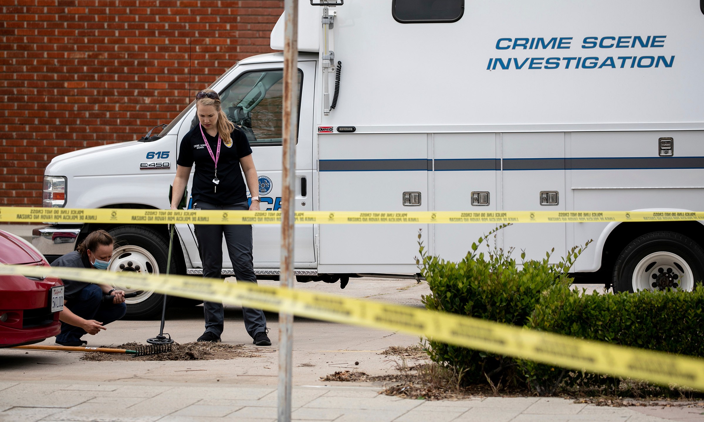 Escondido Police Department investigators search for evidence after an officer shot and killed a man who police said was hitting cars with a metal pry bar in Escondido on April 21, 2021. (Sam Hodgson/The San Diego Union-Tribune via Associated Press)