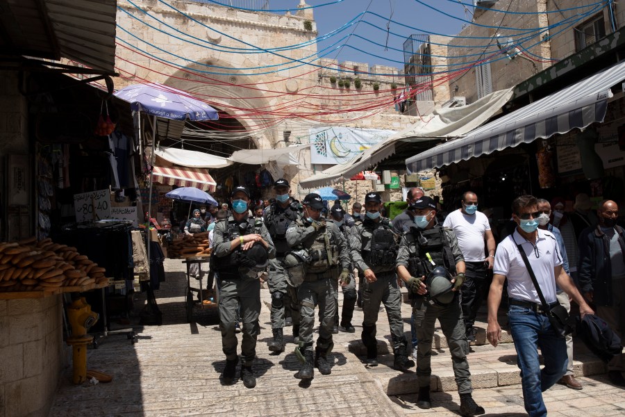 Israeli Border Police patrol the Old City of Jerusalem as worshippers arrive for Friday prayers during the Muslim holy month of Ramadan, on Friday, April 23, 2021. (AP Photo/Maya Alleruzzo)