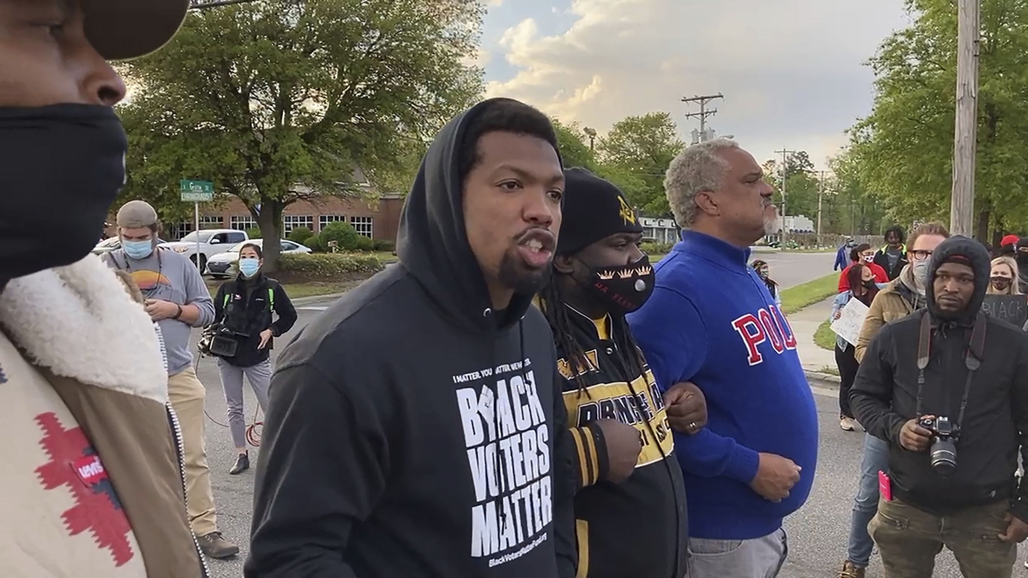 In this image taken from video, Quentin Jackson, regional director for the National Black Caucus of Local Elected Officials, addresses protesters blocking Business U.S. 17 in Elizabeth City, N.C., on Thursday, April 22, 2021. The crowd was demanding that authorities release body camera footage showing the fatal officer-involved shooting of Andrew Brown Jr. the day before. (AP Photo/Allen G. Breed)