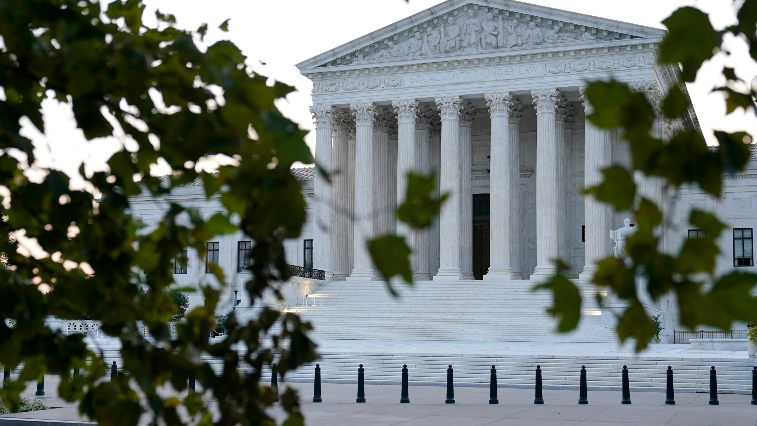 In this Sept. 23, 2020 file photo, the sun rises behind the Supreme Court in Washington. (AP Photo/Patrick Semansky)