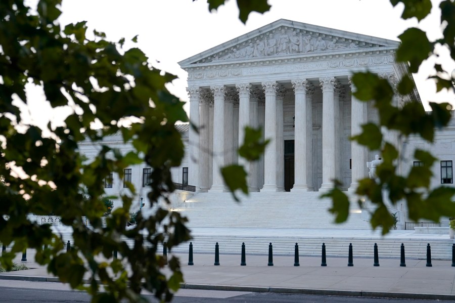 In this Sept. 23, 2020 file photo, the sun rises behind the Supreme Court in Washington. (AP Photo/Patrick Semansky)