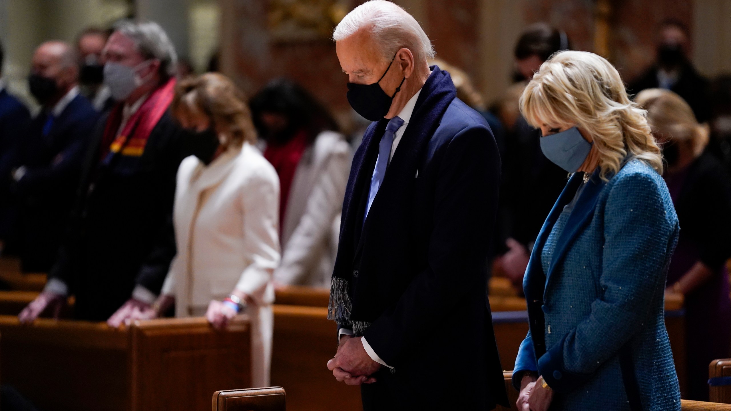 In this Wednesday, Jan. 20, 2021 file photo, President-elect Joe Biden and his wife, Jill Biden, attend Mass at the Cathedral of St. Matthew the Apostle during Inauguration Day ceremonies in Washington. When U.S. Catholic bishops hold their next national meeting in June 2021, they’ll be deciding whether to send a tougher-than-ever message to President Joe Biden and other Catholic politicians: Don’t partake of Communion if you persist in public advocacy of abortion rights. (AP Photo/Evan Vucci)