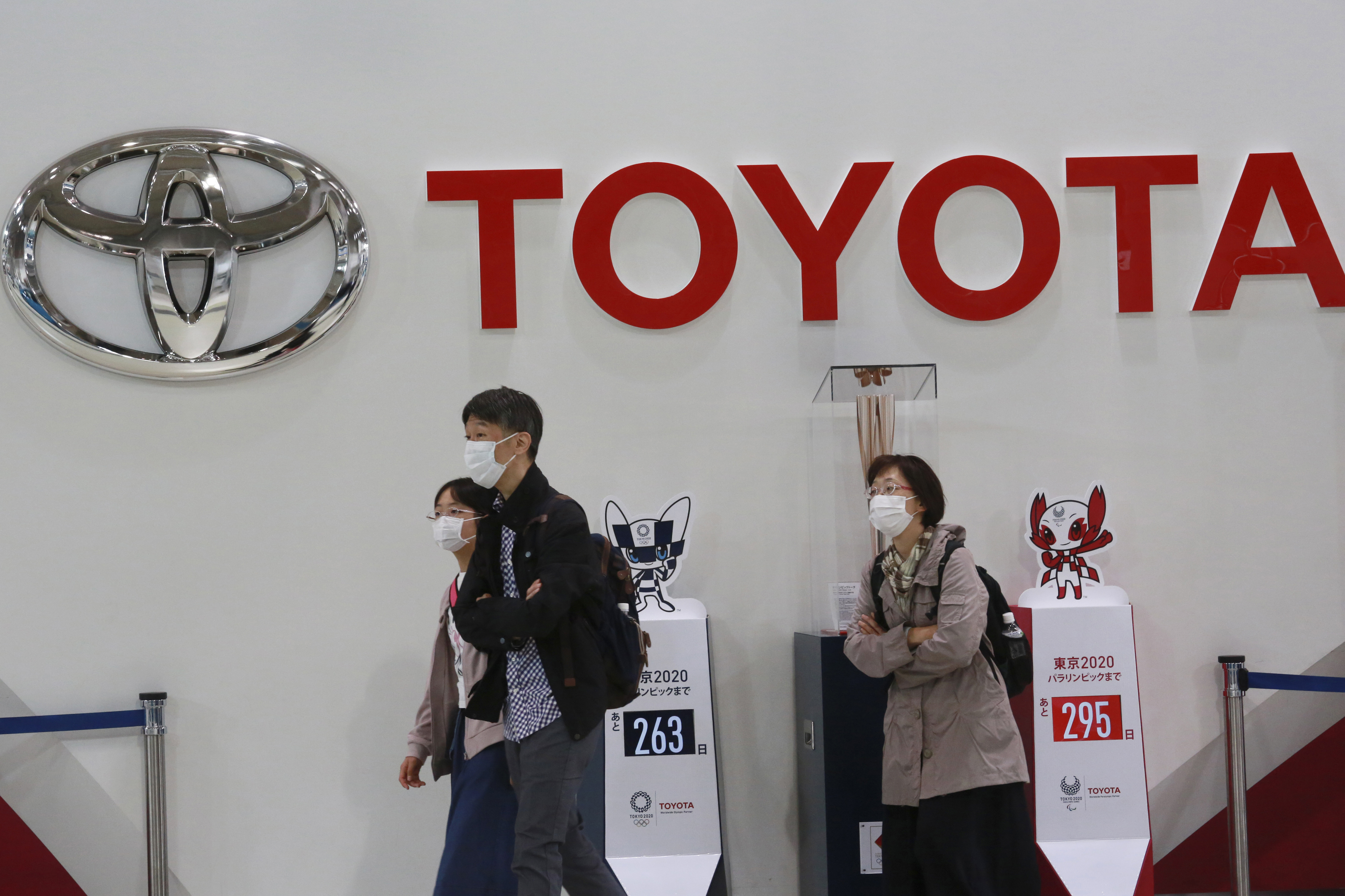 In this Nov. 2, 2020, file photo, visitors walk at a Toyota showroom in Tokyo. (AP Photo/Koji Sasahara, File)