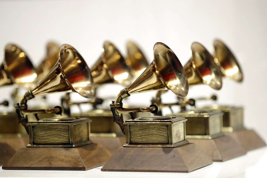 In this Oct. 10, 2017, file photo, various Grammy Awards are displayed at the Grammy Museum Experience at Prudential Center in Newark, N.J. (AP Photo/Julio Cortez, File)