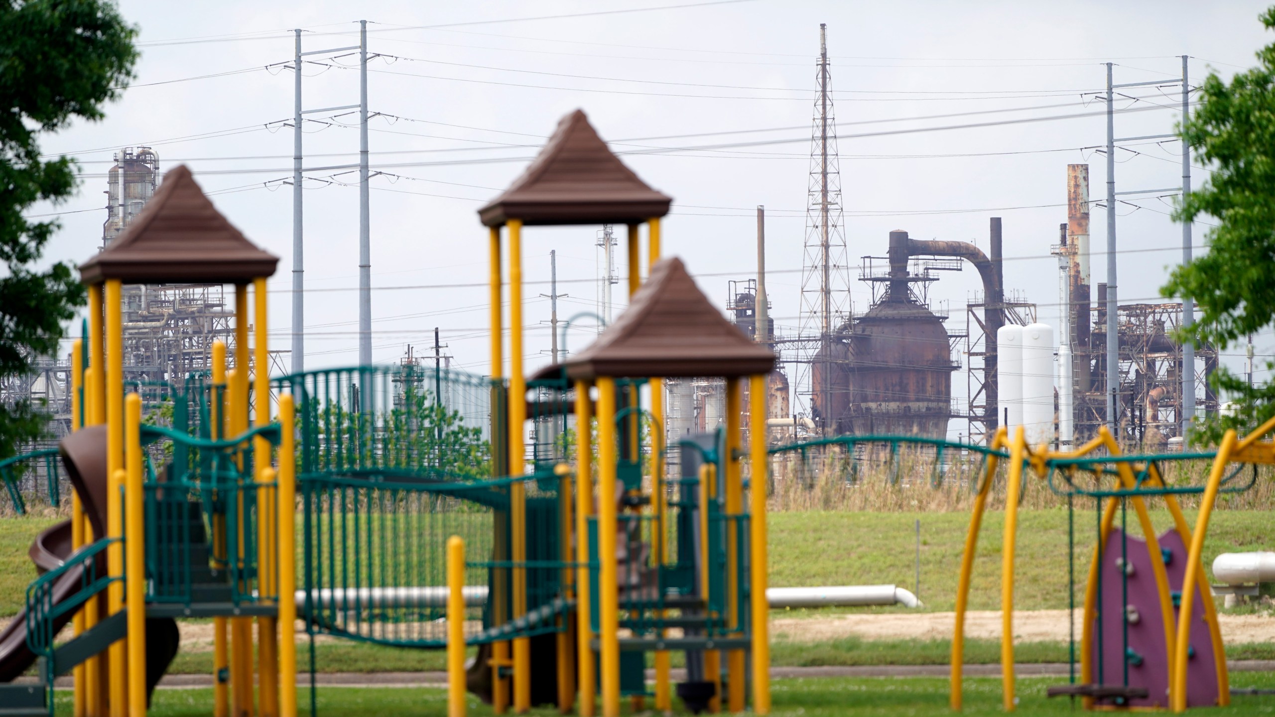 In this March 23, 2020 file photo, a playground outside the Prince Hall Village Apartments sits empty near one of the petrochemical facilities in Port Arthur, Texas. (David J. Phillip)