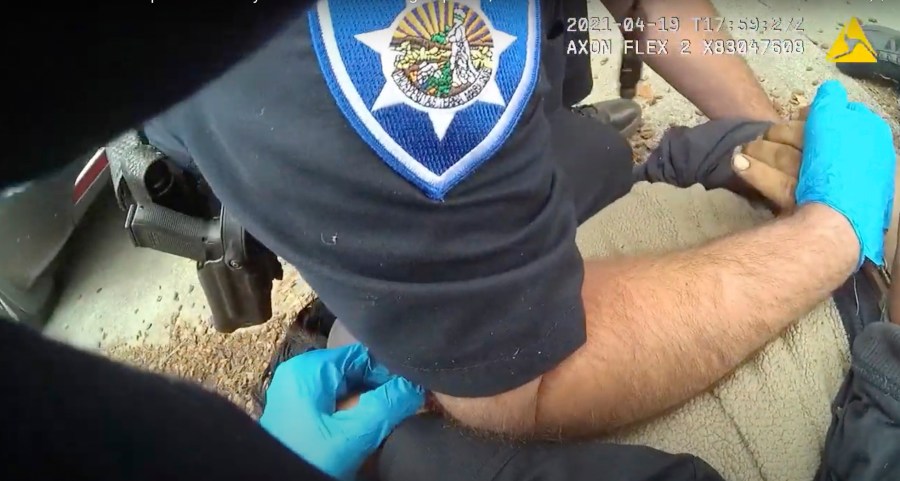 In this image taken from Alameda Police Department body camera video, Alameda Police Department officers pin 26-year-old Mario Gonzalez to the ground during an arrest, April 19, 2021, in Alameda, Calif. Gonzalez stopped breathing during the arrest and was pronounced dead at a hospital. (Alameda Police Department via AP)