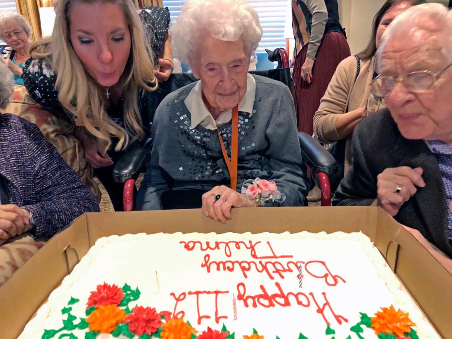 Thelma Sutcliffe is shown with a birthday cake in October 2019, in Omaha, Neb. (Mike Kelly / The World-Herald via Associated Press)