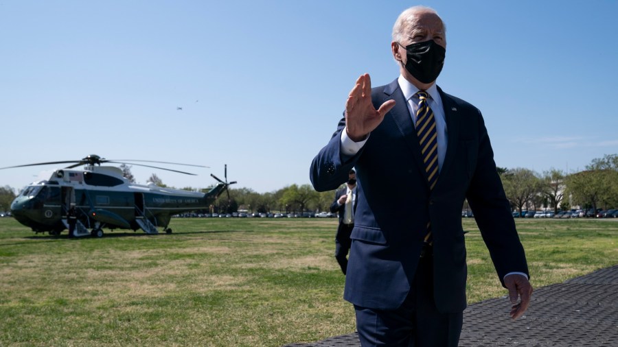 President Joe Biden talks with reporters on the Ellipse on the National Mall after spending the weekend at Camp David, Monday, April 5, 2021, in Washington. (AP Photo/Evan Vucci)