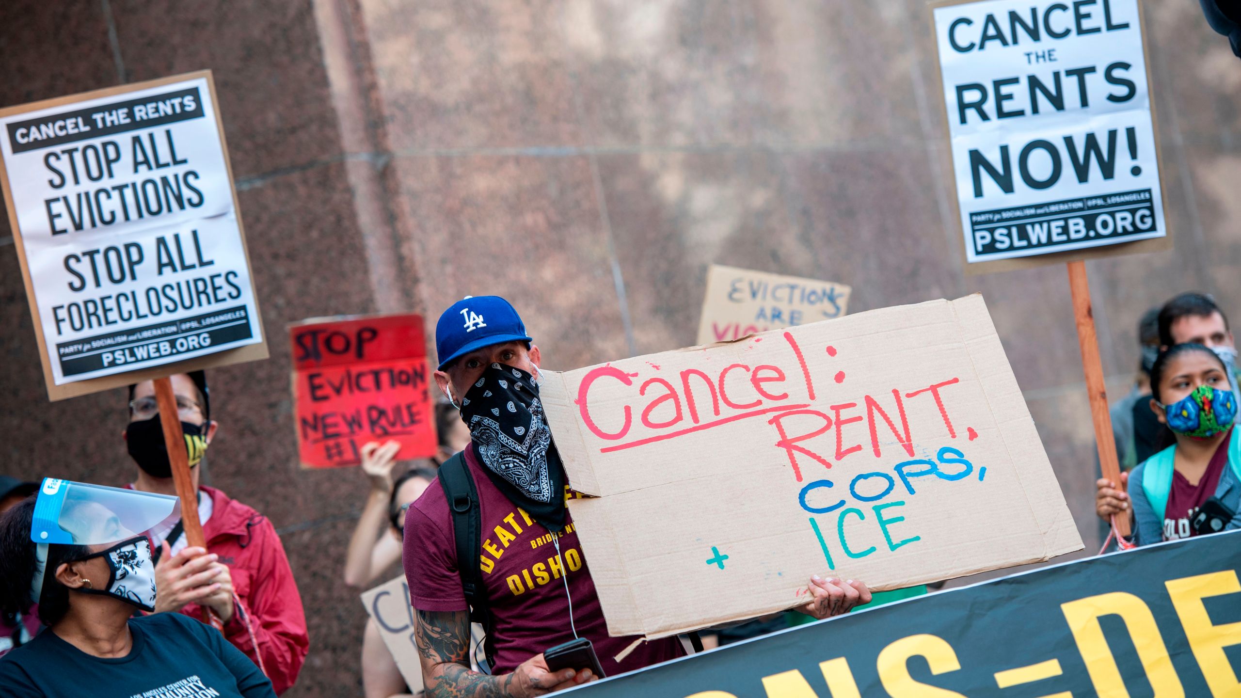 Renters and housing advocates attend a protest to cancel rent and avoid evictions in front of the court house amid Coronavirus pandemic on Aug. 21, 2020, in Los Angeles. (VALERIE MACON/AFP via Getty Images)