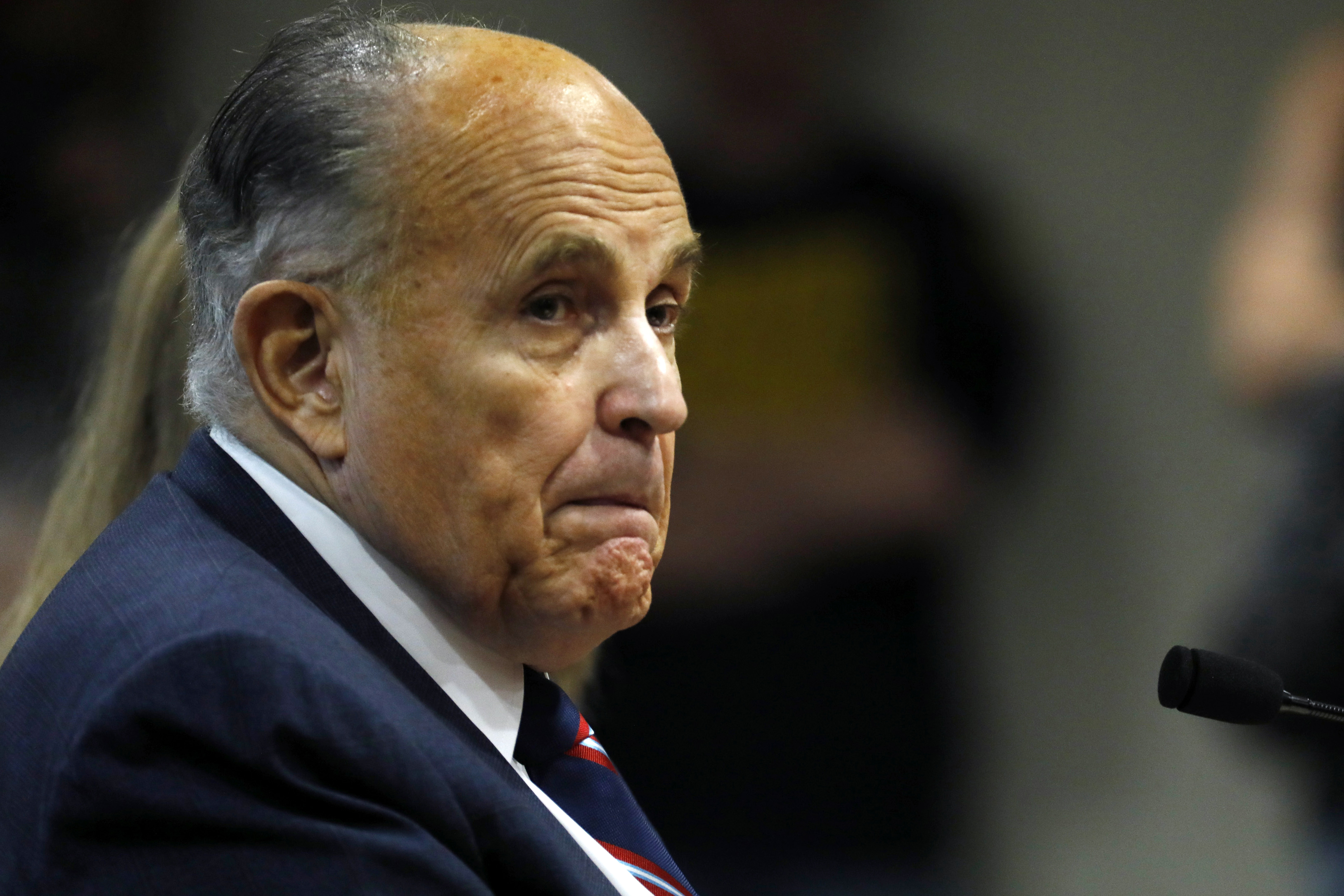 Rudy Giuliani looks on during an appearance before the Michigan House Oversight Committee in Lansing, Michigan on December 2, 2020. (JEFF KOWALSKY/AFP via Getty Images)