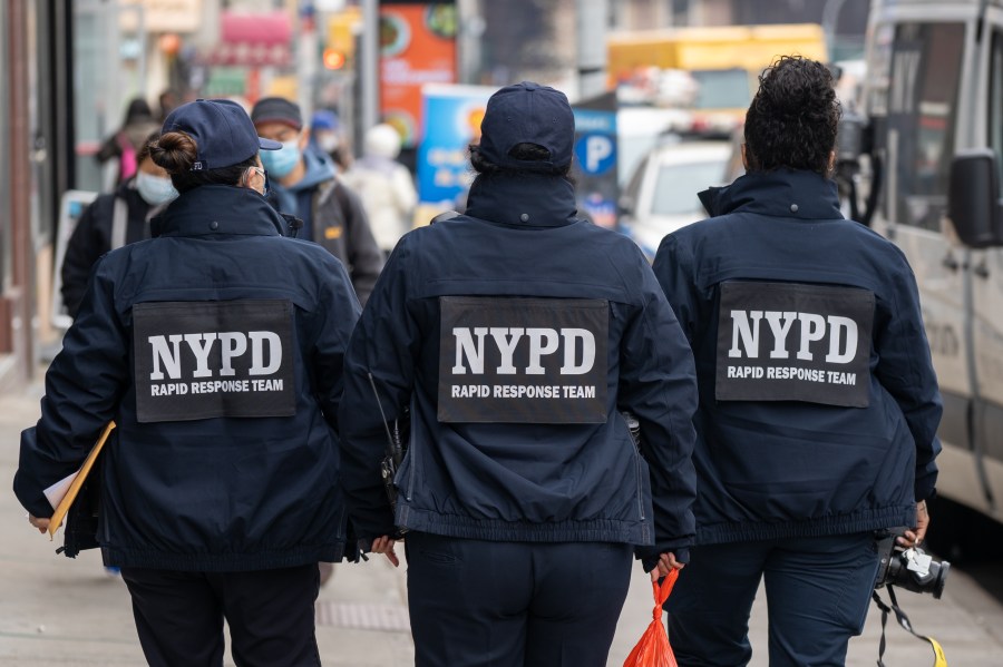 NYPD officers hand out information about hate crimes in Asian communities on March 17, 2021 in New York City. (David Dee Delgado/Getty Images)