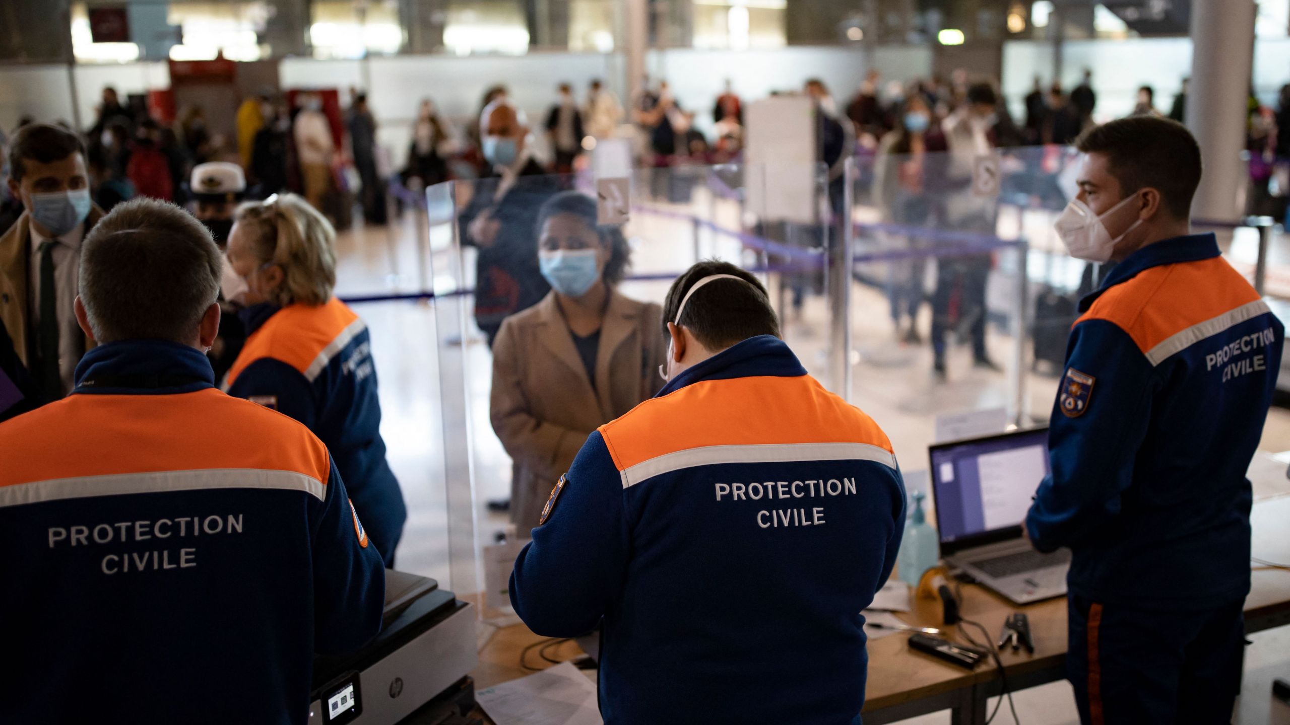 Passengers arriving from countries listed as COVID-19 red zones register for coronavirus tests upon their arrival at Roissy Charles de Gaulle airport in Roissy, near Paris, on April 25, 2021.(IAN LANGSDON/POOL/AFP via Getty Images)