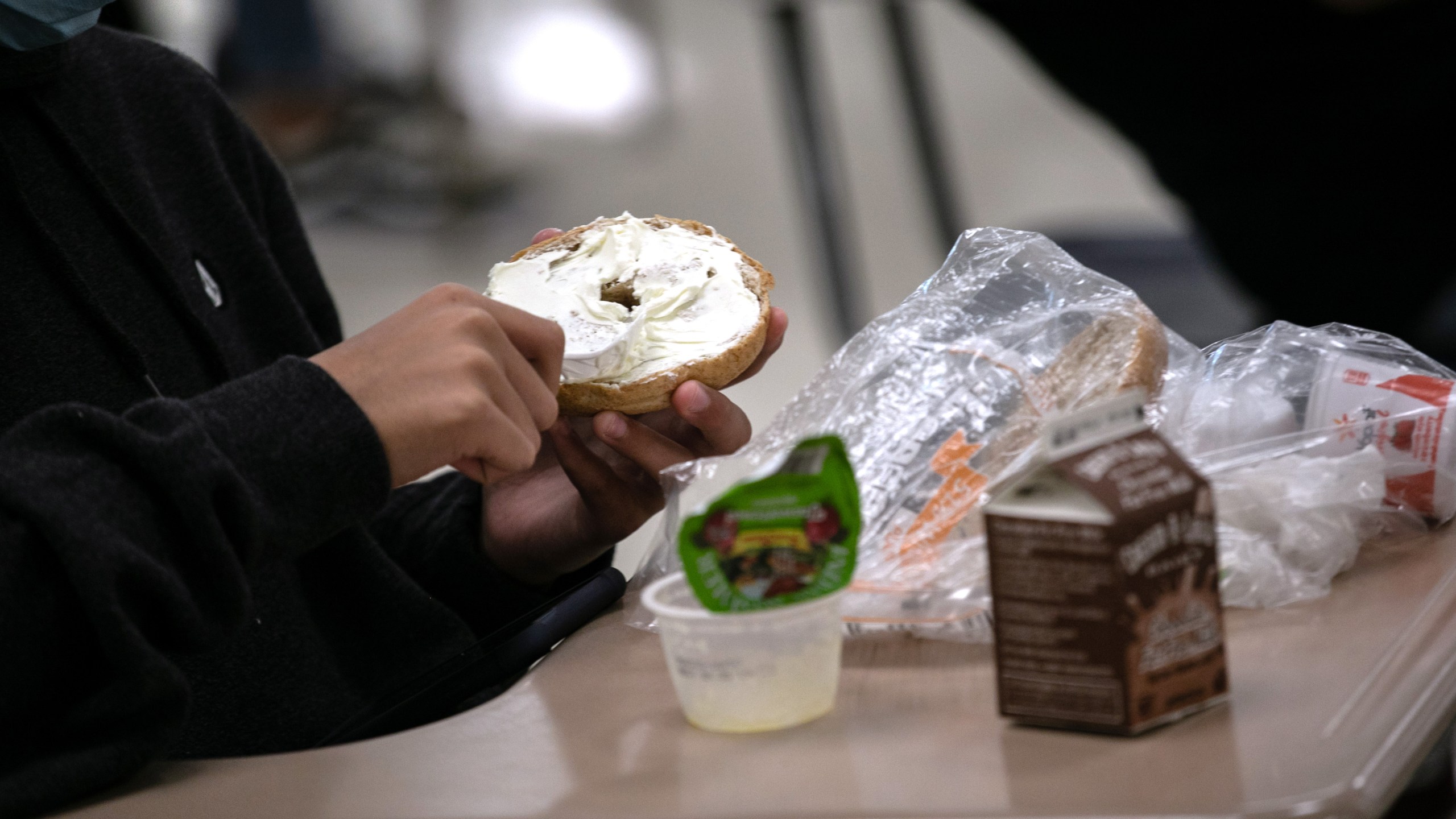 A student prepares lunch in the cafeteria during the first day of school at Stamford High School on Sept. 8, 2020, in Stamford, Connecticut. (John Moore/Getty Images)