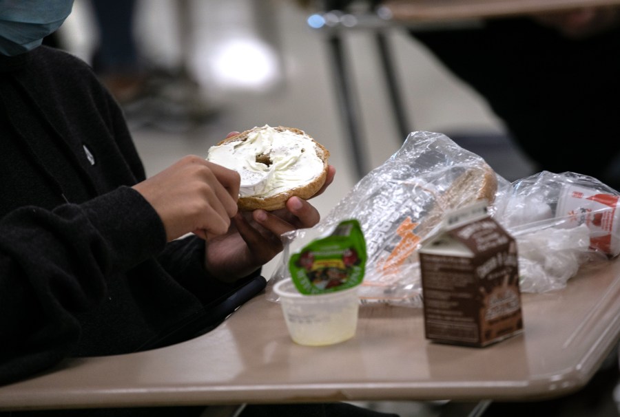 A student prepares lunch in the cafeteria during the first day of school at Stamford High School on Sept. 8, 2020, in Stamford, Connecticut. (John Moore/Getty Images)