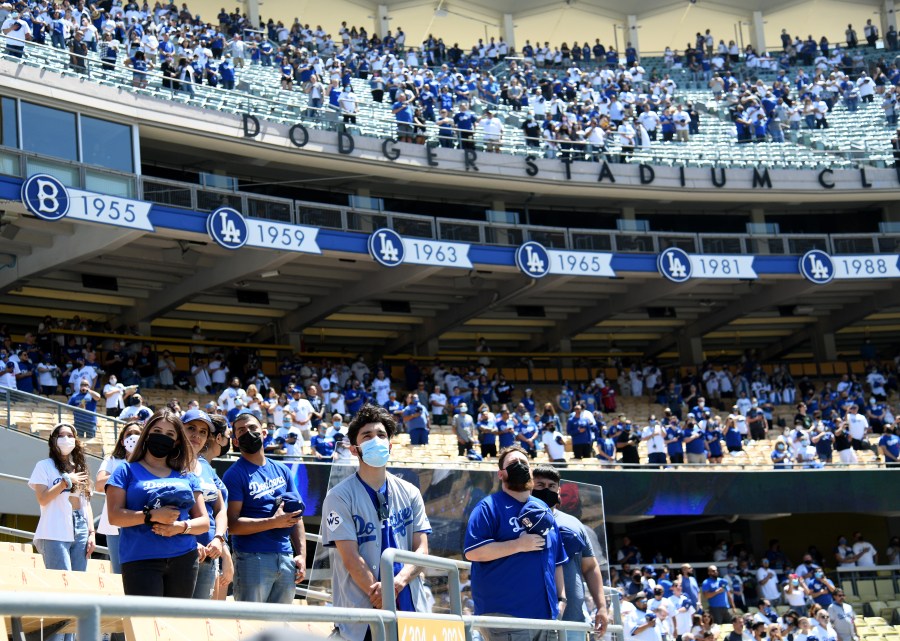 Fans stand for the National Anthem before the game between the Washington Nationals and the Los Angeles Dodgers during the 2021 MLB season home opening game at Dodger Stadium on April 9, 2021. (Harry How/Getty Images)