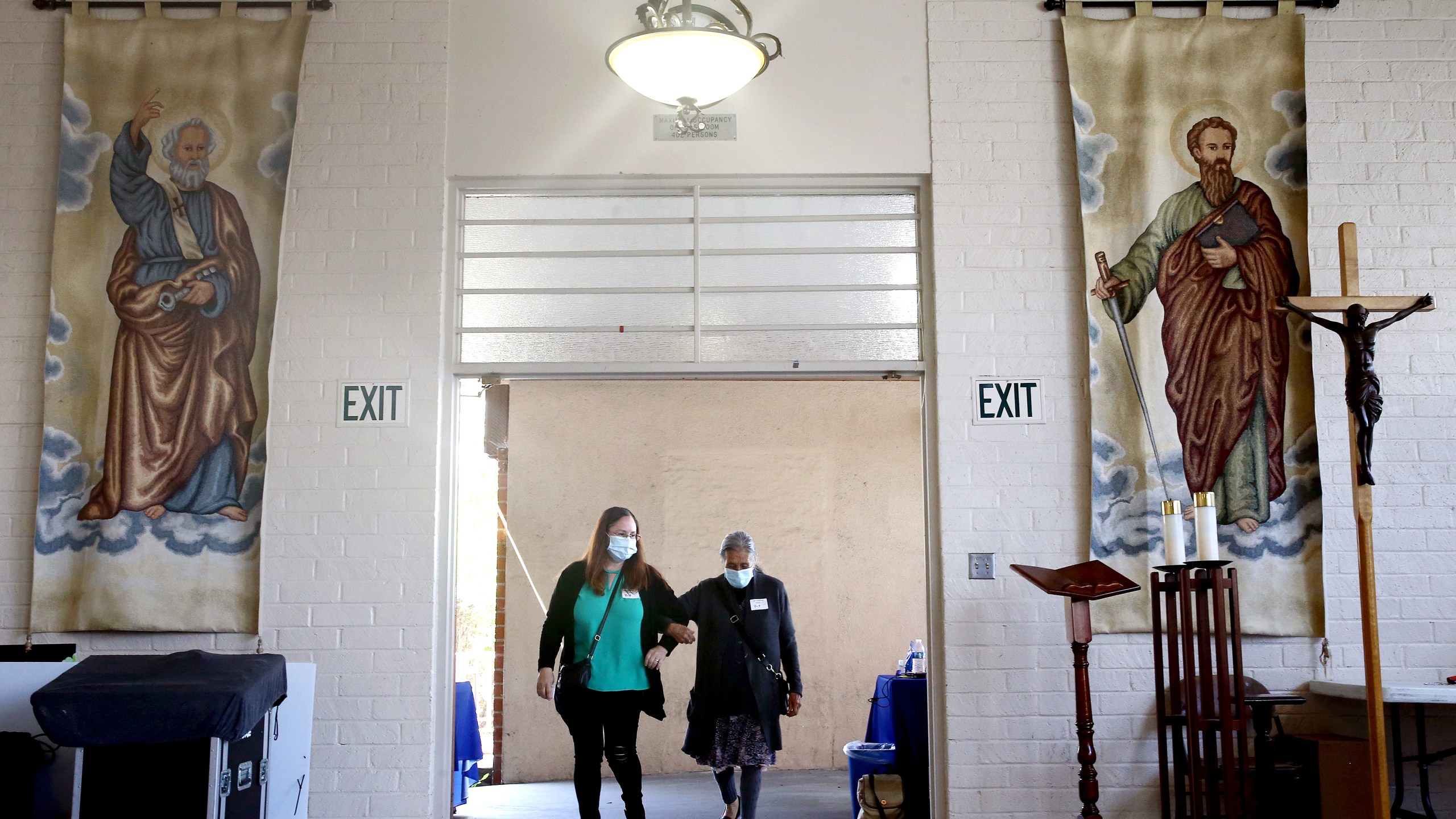 An 86-year-old woman enters to receive her first dose of the Pfizer COVID-19 vaccine at a clinic targeting minority community members at St. Patrick's Catholic Church on April 9, 2021 in Los Angeles, California. (Mario Tama/Getty Images)