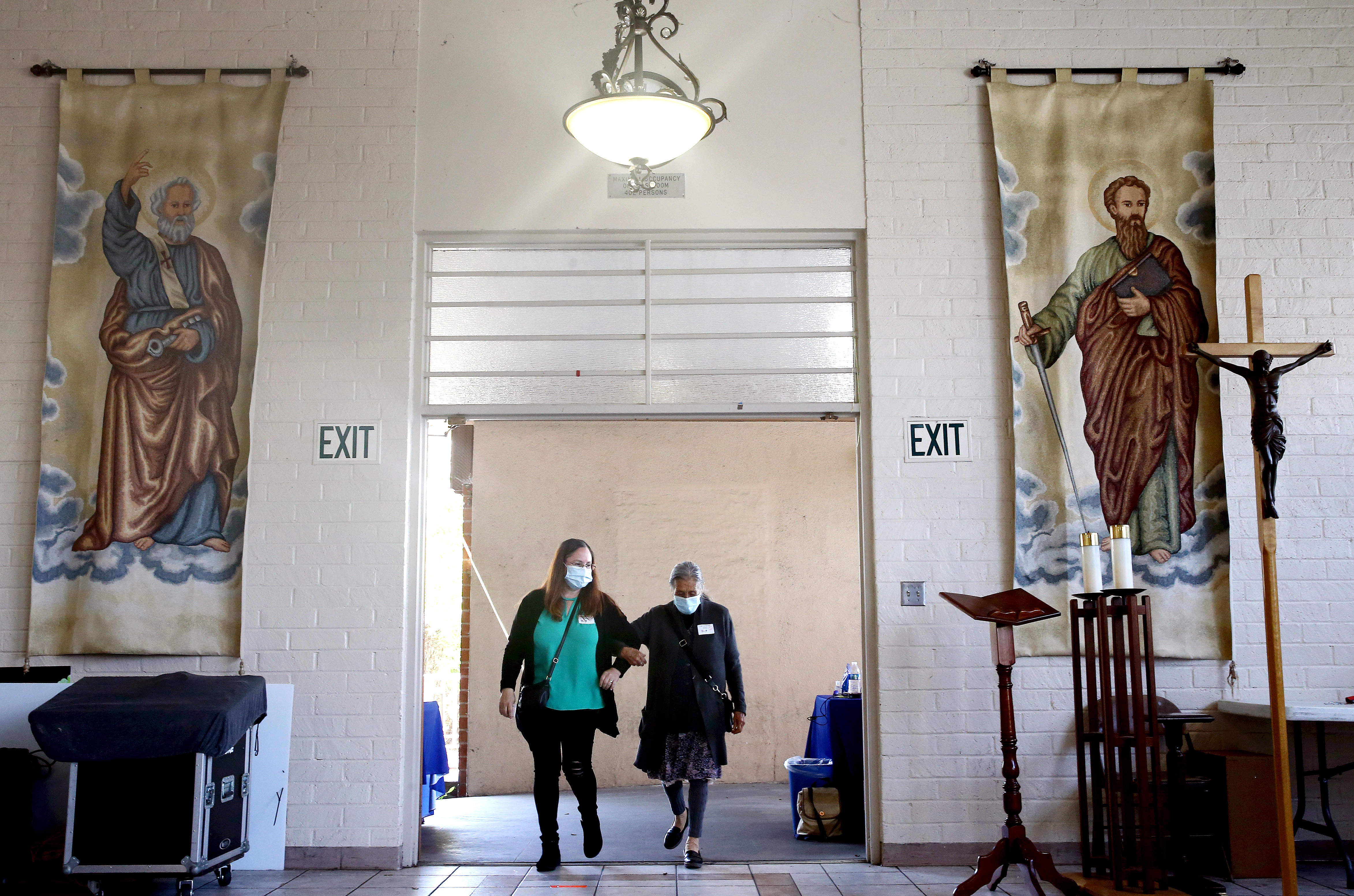 An 86-year-old woman enters to receive her first dose of the Pfizer COVID-19 vaccine at a clinic targeting minority community members at St. Patrick's Catholic Church on April 9, 2021 in Los Angeles, California. (Mario Tama/Getty Images)