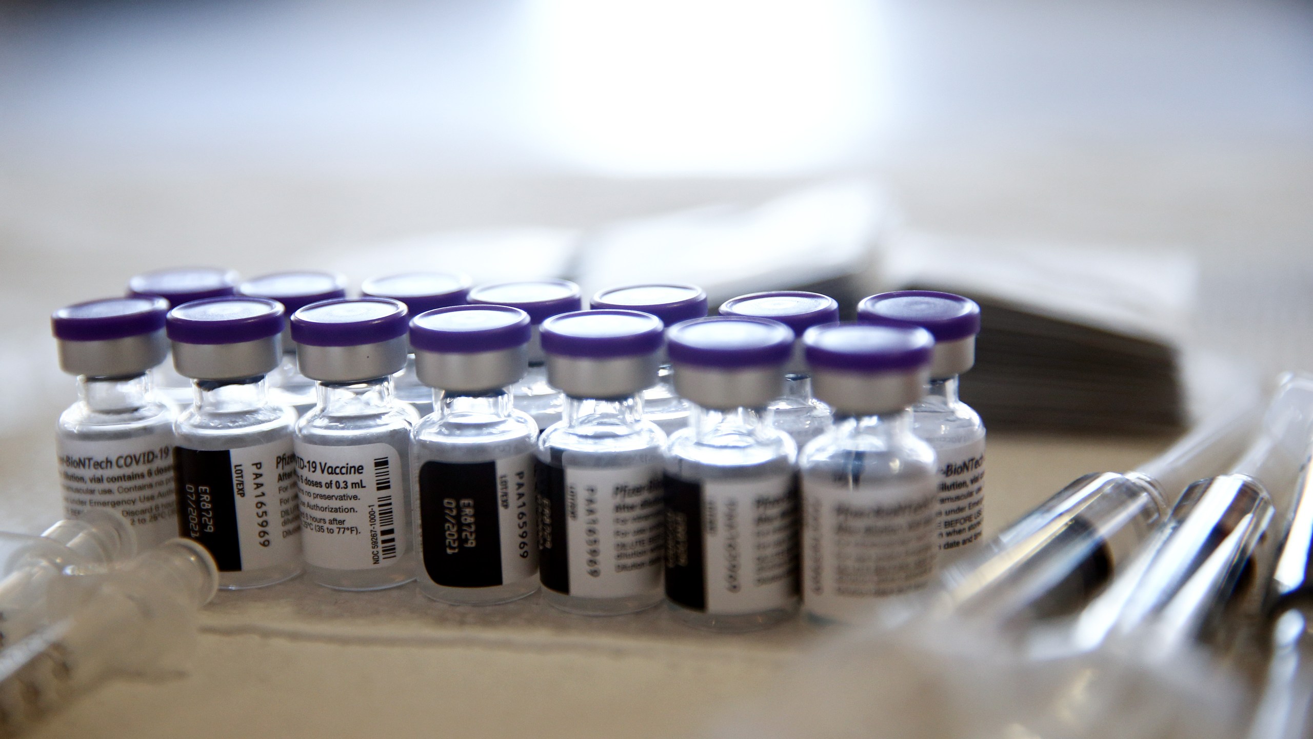 Vials containing doses of the Pfizer COVID-19 vaccine are viewed at a clinic targeting minority community members at St. Patrick's Catholic Church on April 9, 2021 in Los Angeles, California. (Photo by Mario Tama/Getty Images)