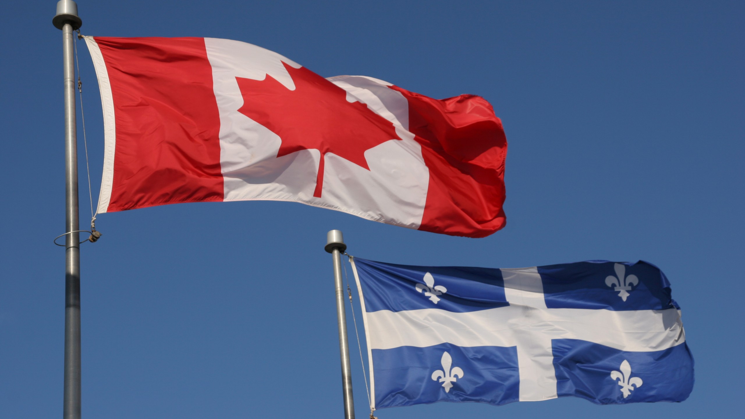 Canadian and Quebec flags are seen in a file photo. (iStock/Getty Images Plus)