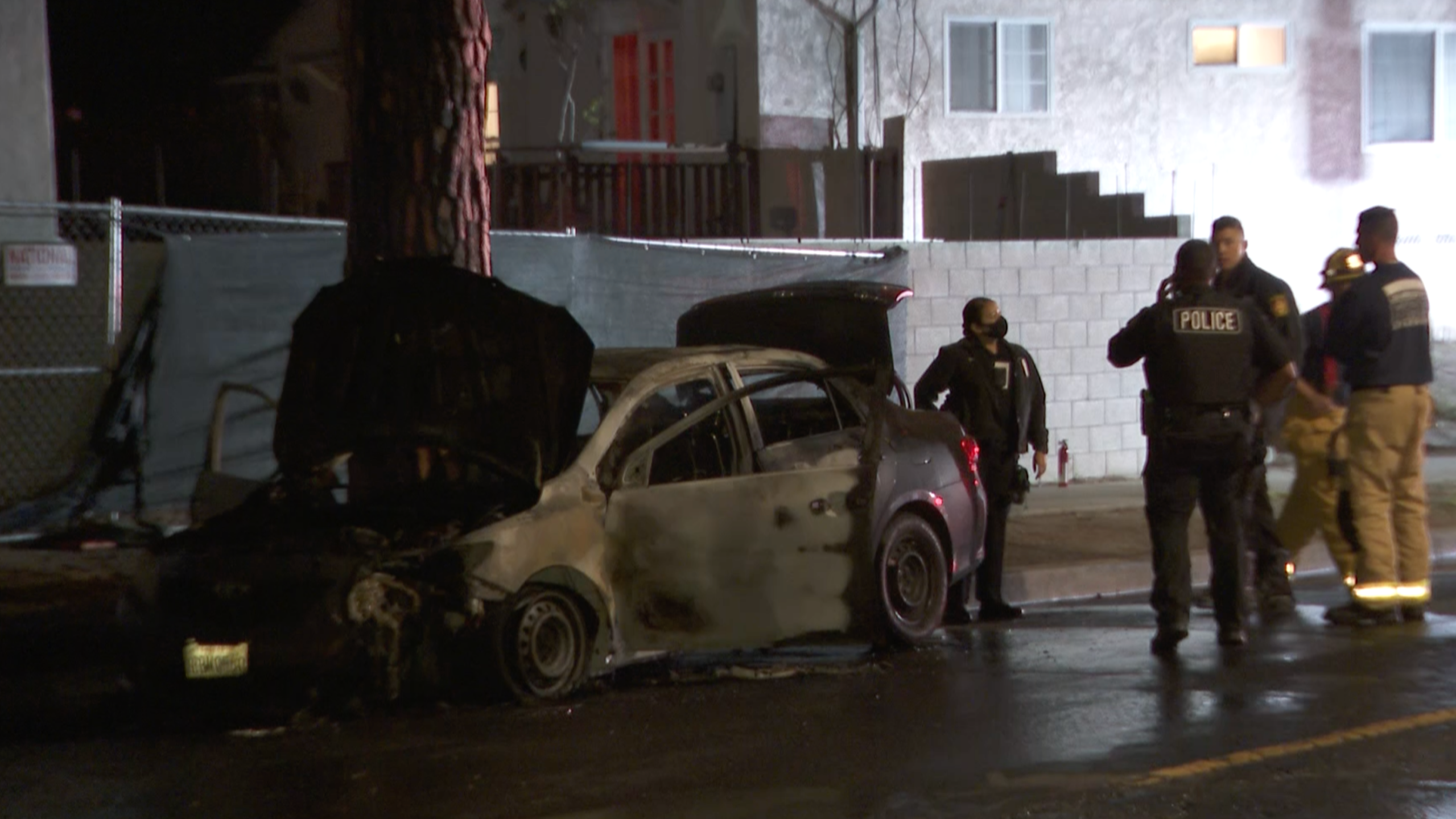 Authorities respond to investigate after a man and stolen vehicle were found engulfed in flames in Rancho Park on April 12, 2021. (KTLA)