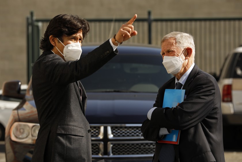 U.S. District Judge David Carter, right, talks with Los Angeles City Councilmember Kevin de León on L.A.'s skid row in February. (Al Seib / Los Angeles Times)