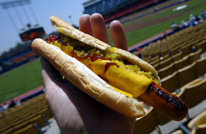 The iconic Dodger Dog with mustard, ketchup and relish. You can still get a Dodger Dog at Dodger Stadium, but it won’t be made by Farmer John.(Los Angeles Times)