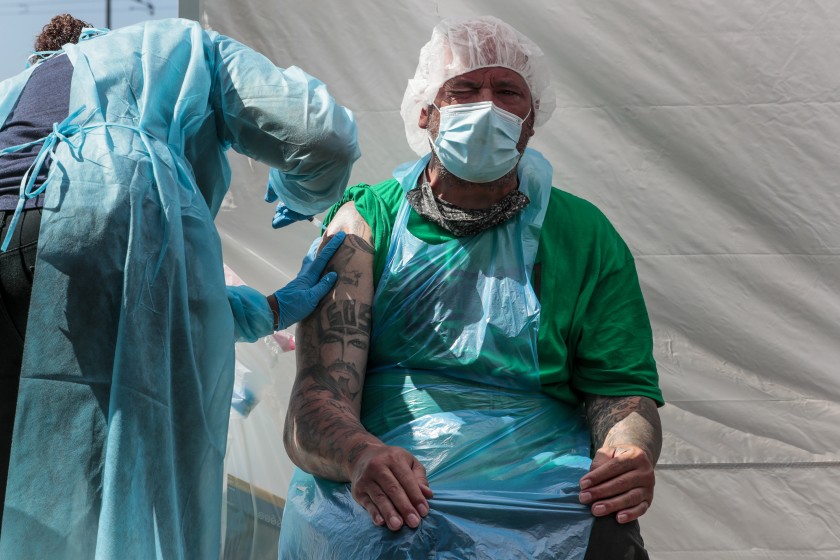 Homeboy employee Joseph Kuresa recieves a shot from Shaun Murry. (Robert Gauthier/Los Angeles Times)