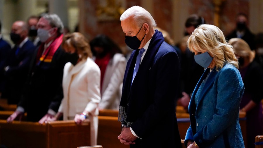 President-elect Joe Biden and his wife, Jill Biden, attend Mass at the Cathedral of St. Matthew the Apostle during Inauguration Day ceremonies in Washington on Jan 20, 2021. (Evan Vucci / Associated Press)