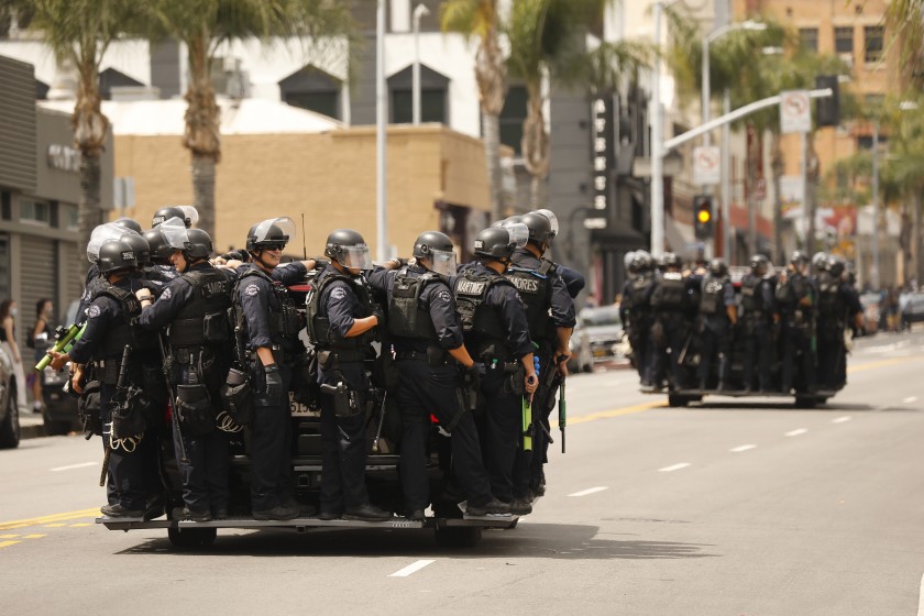 LAPD officers respond to a protest in Hollywood in early June 2020. (Al Seib / Los Angeles Times)