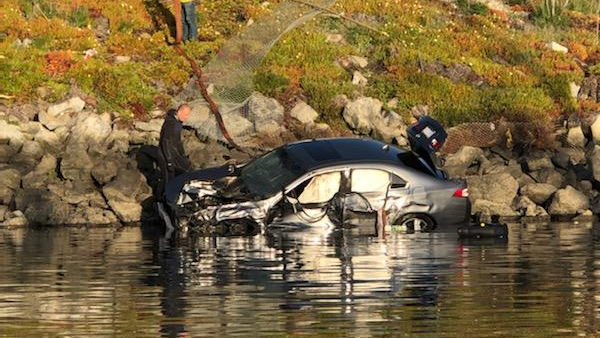 Authorities work to extricate victims after a car crashed into a river at the Moss Landing harbor in Monterey County on April 10, 2021, in a photo released by the Monterey County Sheriff’s Office.