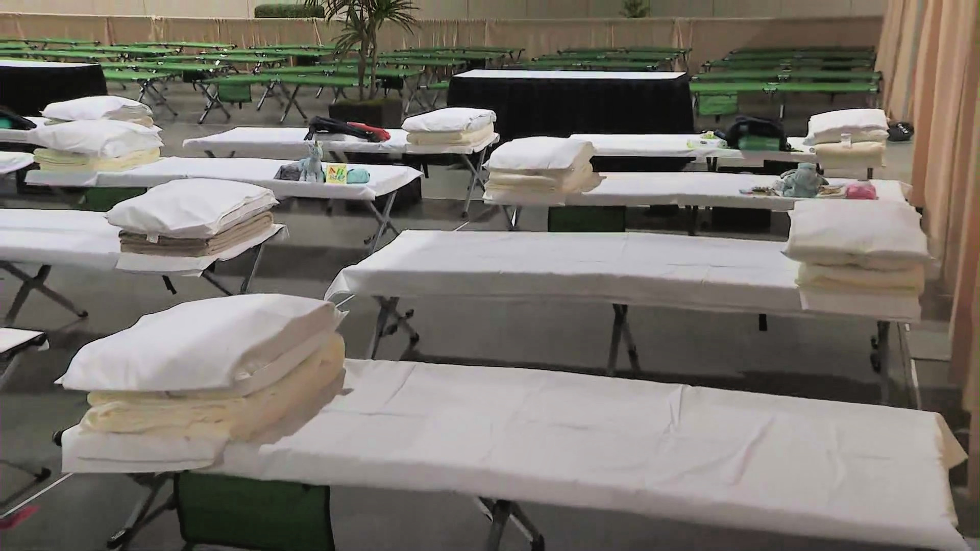 Beds for migrant children line the Long Beach Convention Center on April 22, 2021. (KTLA)