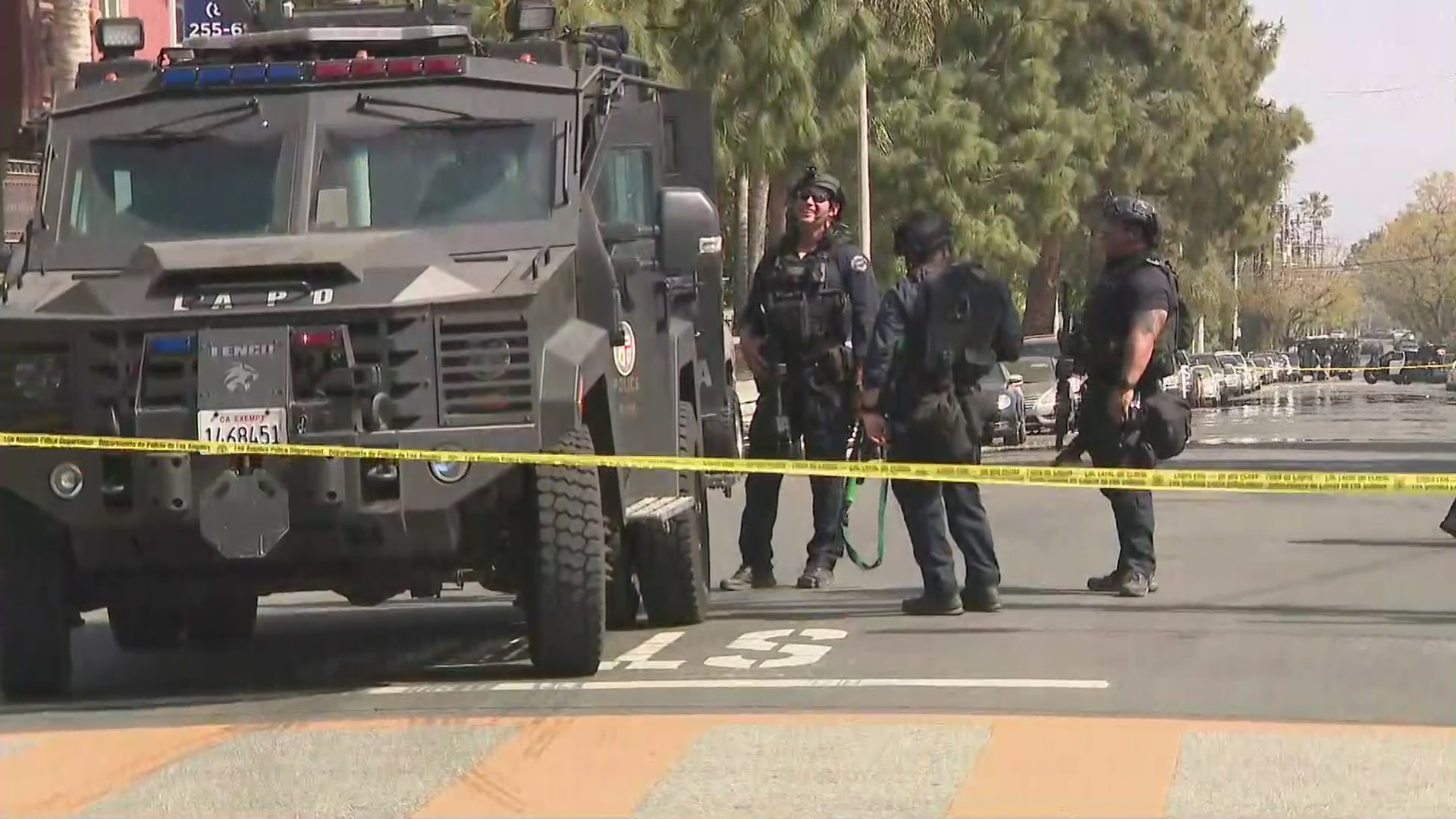 Police are seen outside a Sylmar school that had to be evacuated after reports of a man with a rifle on April 12, 2021. (KTLA)