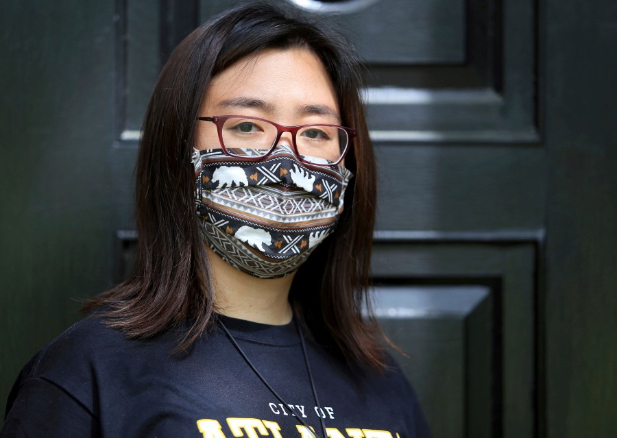 Claire Xu, poses for a photo, Friday, April 9, 2021, in Decatur, Ga., Xu was propelled into action following the mass fatal shootings of eight people, six of them Asian women, at a Georgia massage businesses in March. She organized a massive rally condemning violence against Asian Americans that drew support from a broad group of activists, elected officials and community members. But her own parents were opposed. “'We don’t want you to do this,'” Xu, 31, recalled their telling her afterward. "'You can write about stuff, but don’t get your face out there.'” (AP Photo/Akili-Casundria Ramsess)