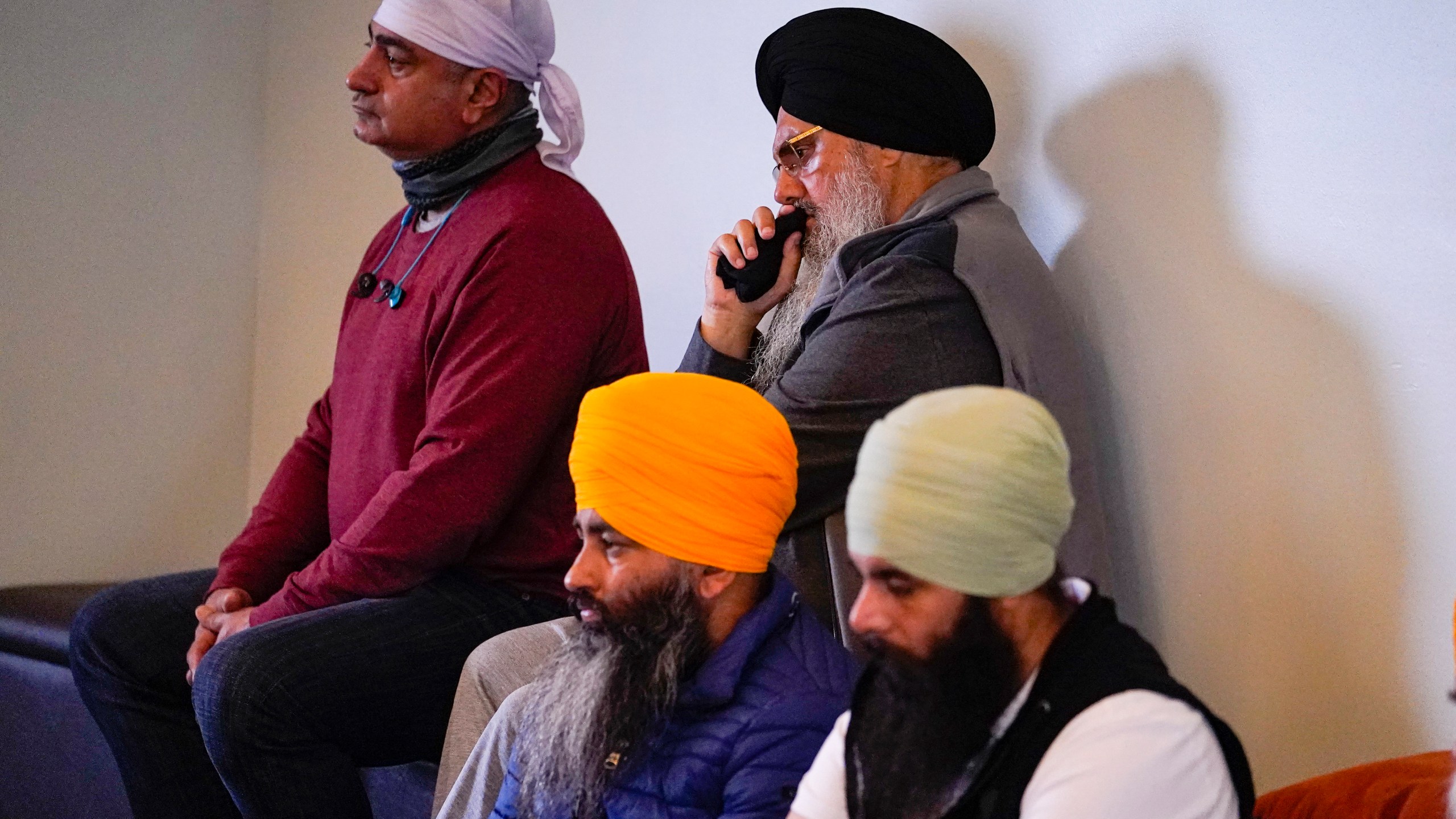 Members of the Sikh Coalition gather at the Sikh Satsang of Indianapolis in Indianapolis, Saturday, April 17, 2021 to formulate the groups response to the shooting at a FedEx facility in Indianapolis that claimed the lives of four members of the Sikh community. A gunman killed eight people and wounded several others before taking his own life in a late-night attack at a FedEx facility near the Indianapolis airport. (AP Photo/Michael Conroy)