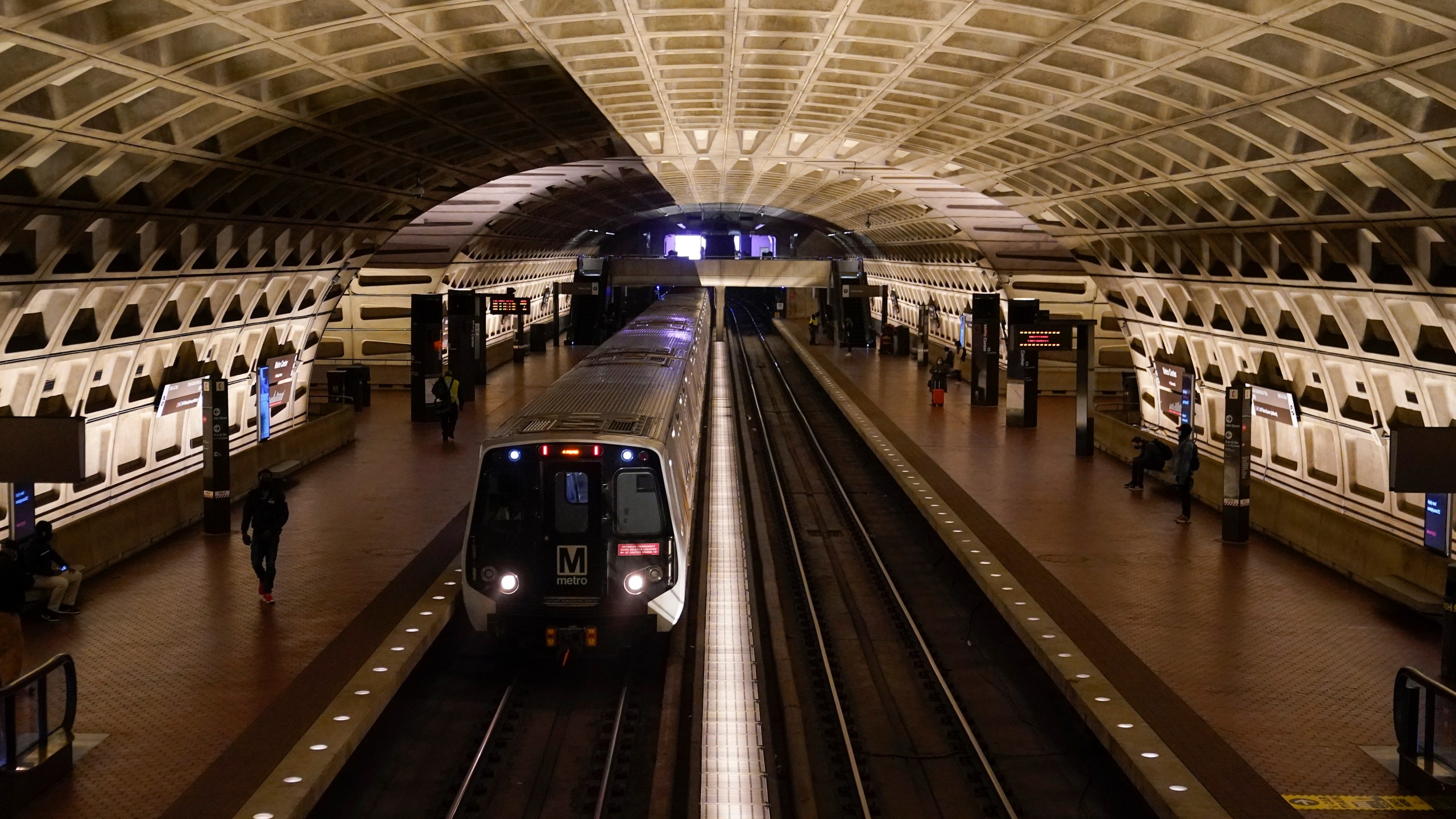 A train arrives at Metro Center station, Friday, April 23, 2021, in Washington. As President Joe Biden urges more federal spending for public transportation, transit agencies decimated by COVID-19 are struggling with a new uncertainty: how to win passengers back. (AP Photo/Patrick Semansky)