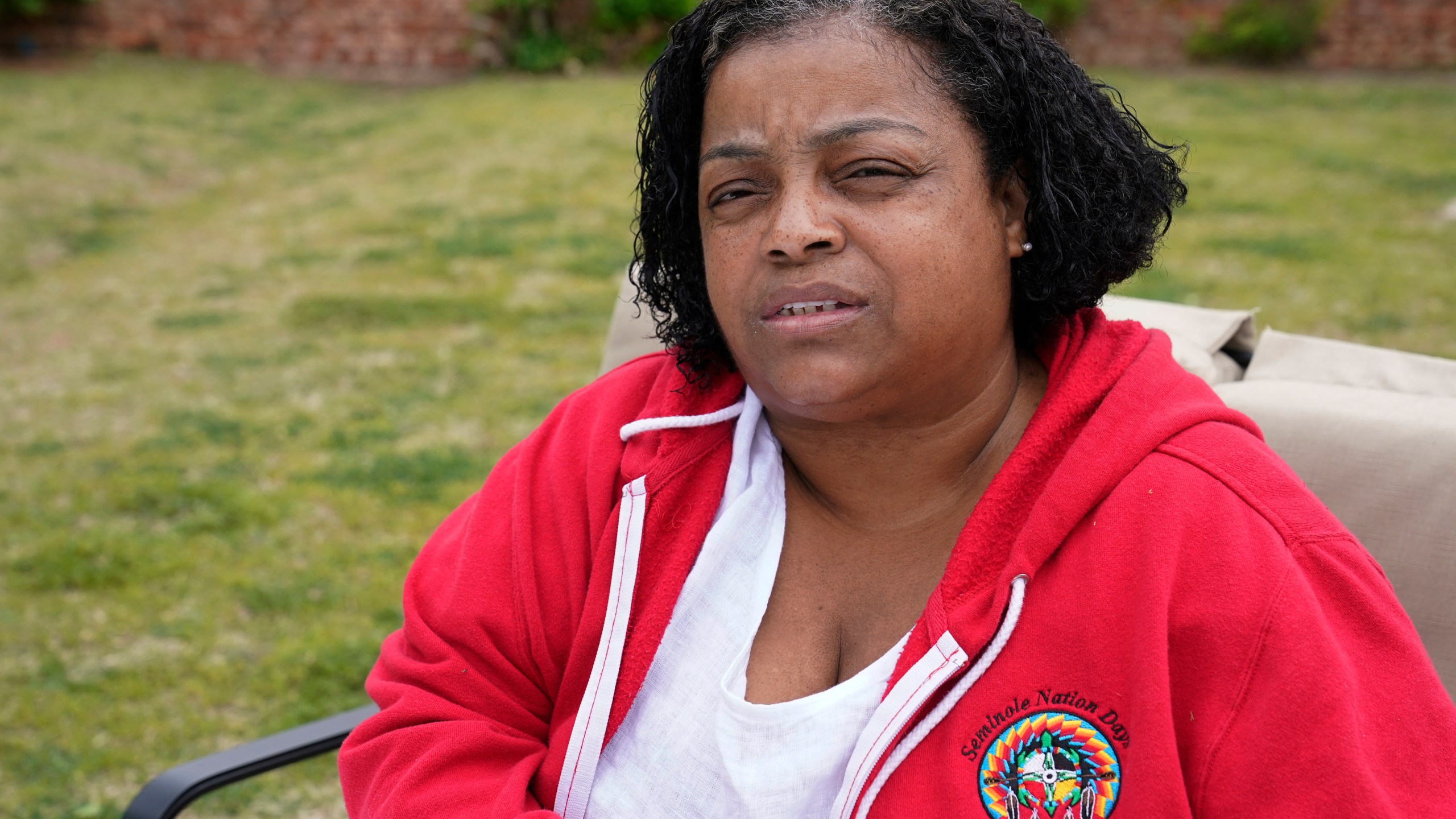 LeEtta Osborne-Sampson is pictured outside her home Monday, April 26, 2021, in Oklahoma City. Sampson-Osborn, a Seminole Freedman who has a tribal identification card and serves on the tribe's governing council, said when she went to the Indian Health Services clinic to get a vaccination in February, a worker at the clinic told her the Seminole Nation doesn't recognize Freedmen for health services. (AP Photo/Sue Ogrocki)