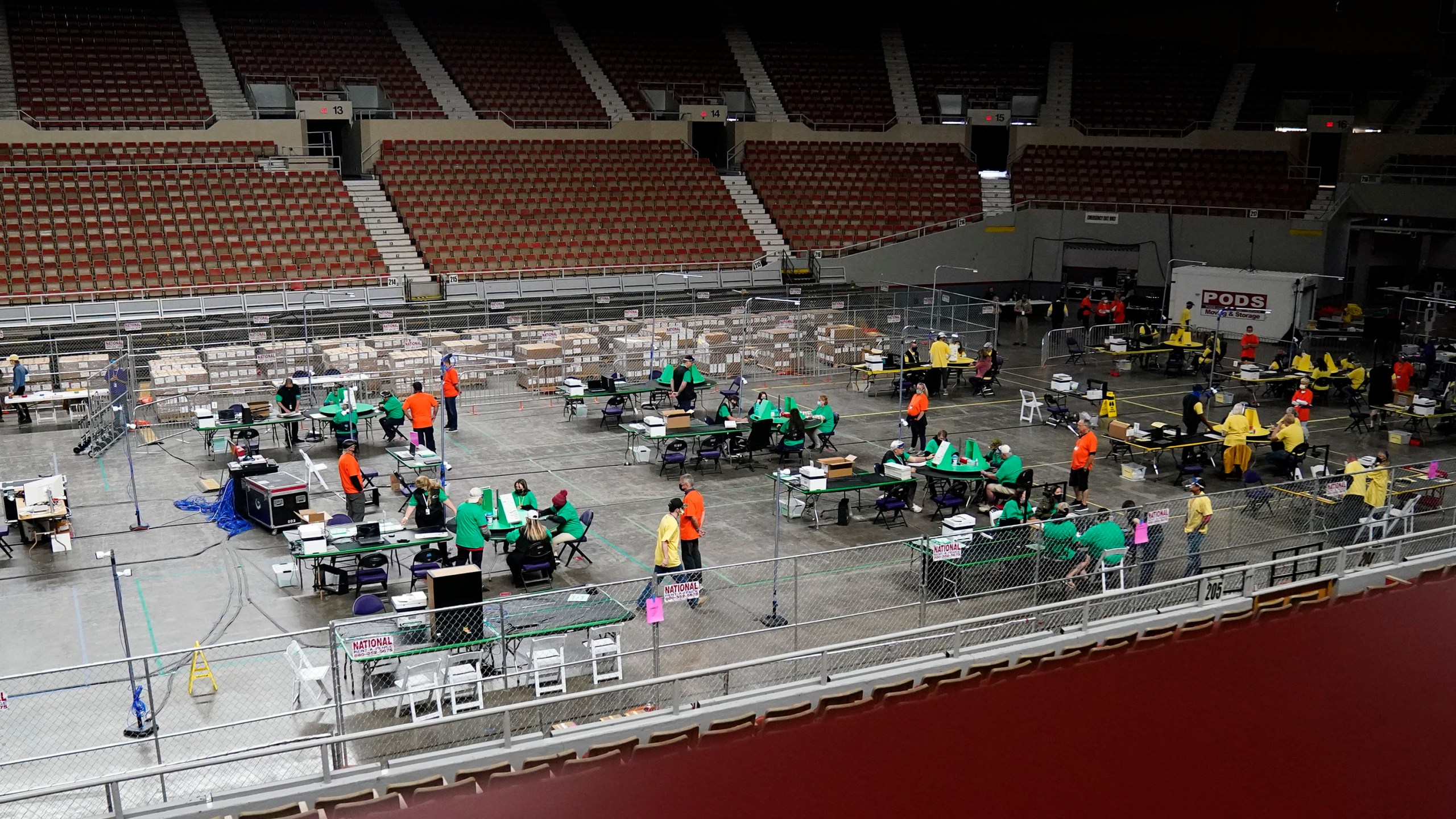 Maricopa County ballots cast in the 2020 general election are being examined and recounted by contractors working for Florida-based company, Cyber Ninjas, who was hired by the Arizona State Senate at Veterans Memorial Coliseum in Phoenix, Thursday, April 29, 2021. (Rob Schumacher/The Arizona Republic via AP, Pool)