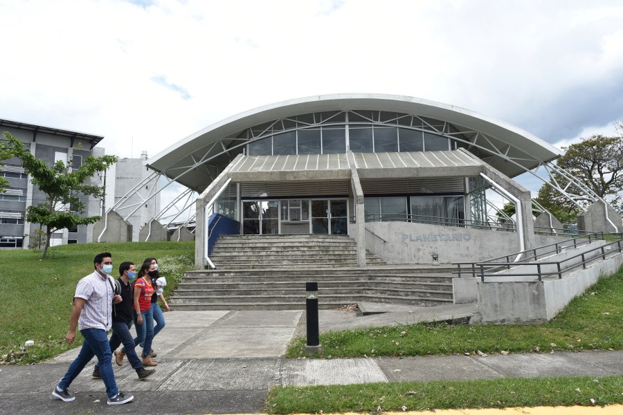 Students walks past the Solar Astronomical Observatory in San Jose, Costa Rica, Friday, April 30, 2021. Costa Rica approved a law creating a space agency on Feb. 18. (AP Photo/Carlos Gonzalez)