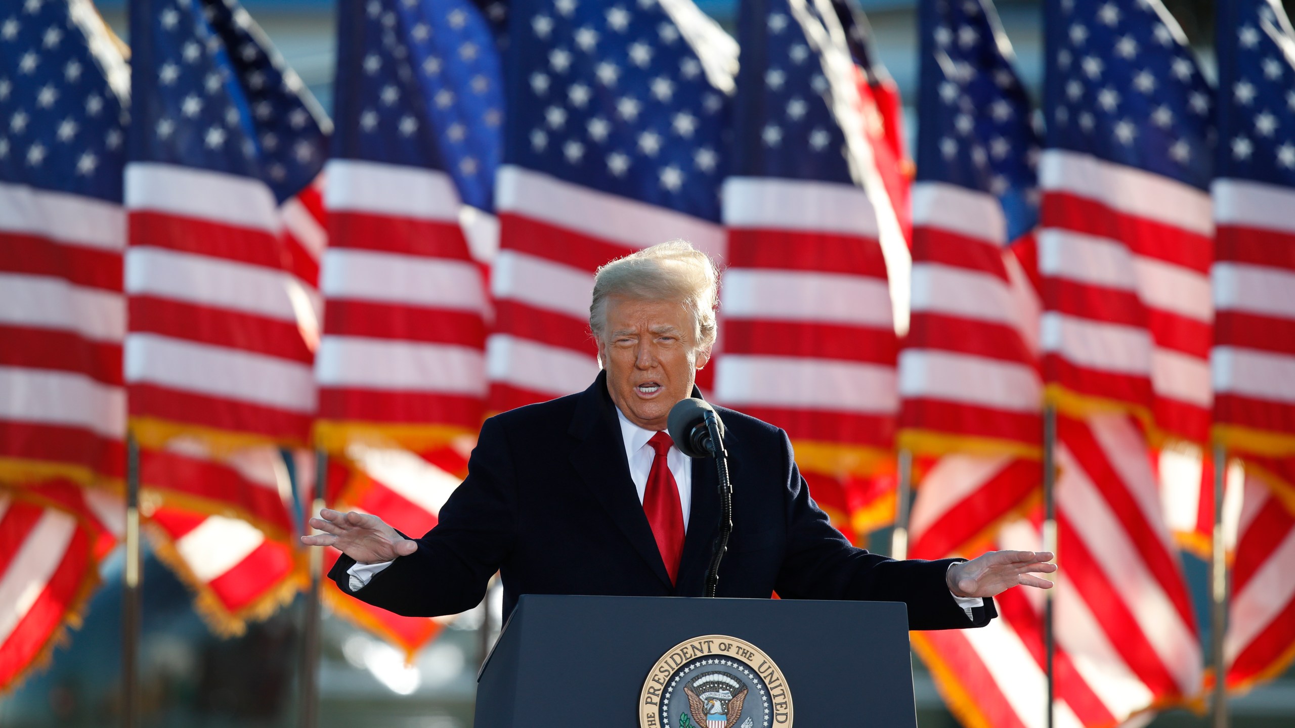 President Donald Trump speaks to crowd before boarding Air Force One at Andrews Air Force Base, Md., in this Wednesday, Jan. 20, 2021, file photo. (AP Photo/Luis M. Alvarez, File)