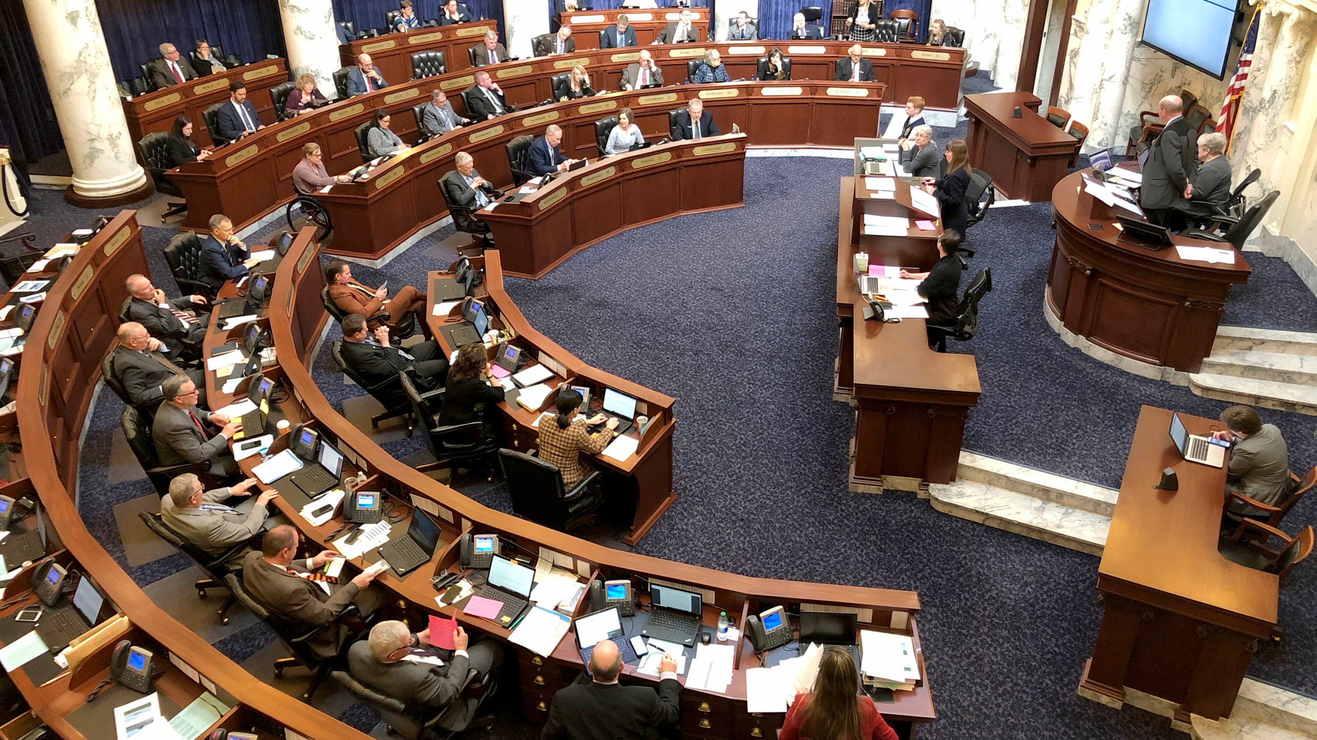 In this Feb. 27, 2020, file photo, Idaho House of Representatives debates legislation in the Idaho Statehouse in Boise, Idaho. Idaho lawmakers moved forward with legislation banning transgender people from changing the sex listed on their birth certificates despite a federal court ruling declaring such a ban unconstitutional. An appeals court on Monday, May 3, 2021, will consider the constitutionality of the first law in the nation banning transgender women and girls from playing on women's sports teams. The 9th U.S. Circuit Court of Appeals will hear arguments in the case that will likely have far-ranging consequences as more states follow conservative Idaho's lead. (AP Photo/Keith Ridler, File)