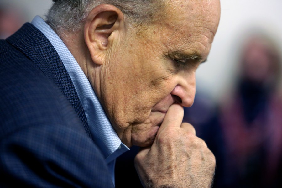 Former New York Mayor Rudy Giuliani pauses while addressing supporters of President Donald Trump during a Columbus Day gathering at a Trump campaign field office in Philadelphia on Oct. 12, 2020. (Jacqueline Larma / Associated Press)