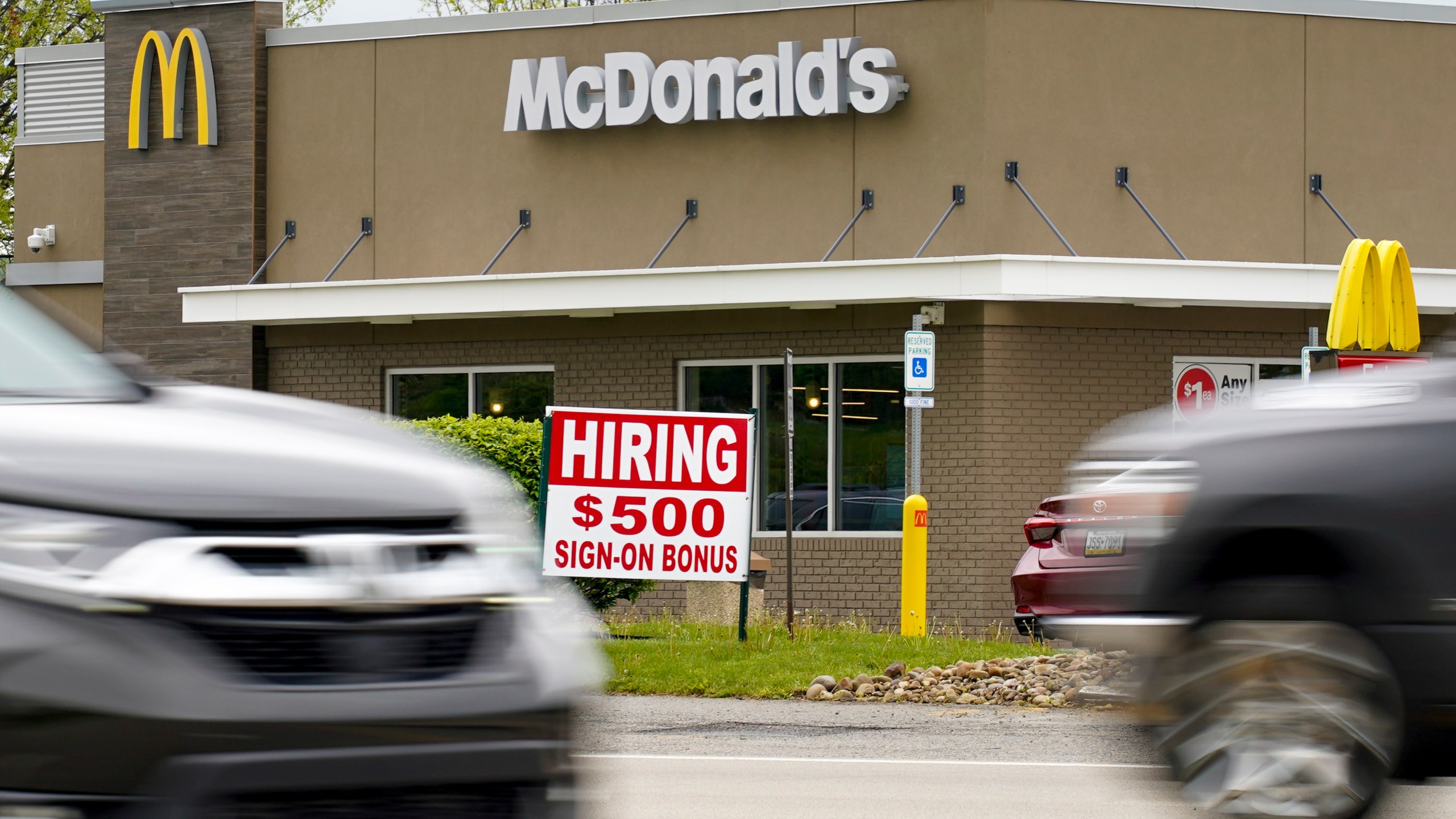 A hiring sign offers a $500 bonus outside a McDonalds restaurant, in Cranberry Township, Butler County, Pa., Wednesday, May 5, 2021. U.S. employers posted a record number of available jobs in March, starkly illustrating the desperation of businesses to hire more people as the economy expands. Yet total job gains increased only modestly that month, according to a Labor Department report issued Tuesday, May 11. (AP Photo/Keith Srakocic)