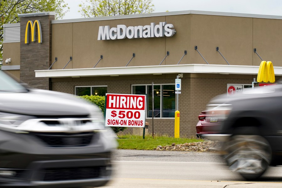 A hiring sign offers a $500 bonus outside a McDonalds restaurant, in Cranberry Township, Butler County, Pa., Wednesday, May 5, 2021. U.S. employers posted a record number of available jobs in March, starkly illustrating the desperation of businesses to hire more people as the economy expands. Yet total job gains increased only modestly that month, according to a Labor Department report issued Tuesday, May 11. (AP Photo/Keith Srakocic)