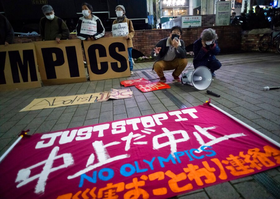 In this March 25, 2021, file photo, a "No Olympics" banner is placed by protesters in Tokyo during a demonstration against the going ahead of the Tokyo 2020 Olympic and Paralympic Games. (AP Photo/Hiro Komae, File)